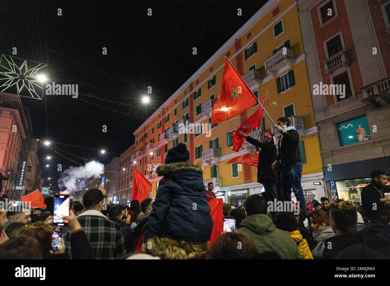 Milan, Italy, 06th Dec 2022. Moroccan Fans celebrate historic World Cup win against Spain in Corso Buenos Aires, Milan, Italy Stock Photo