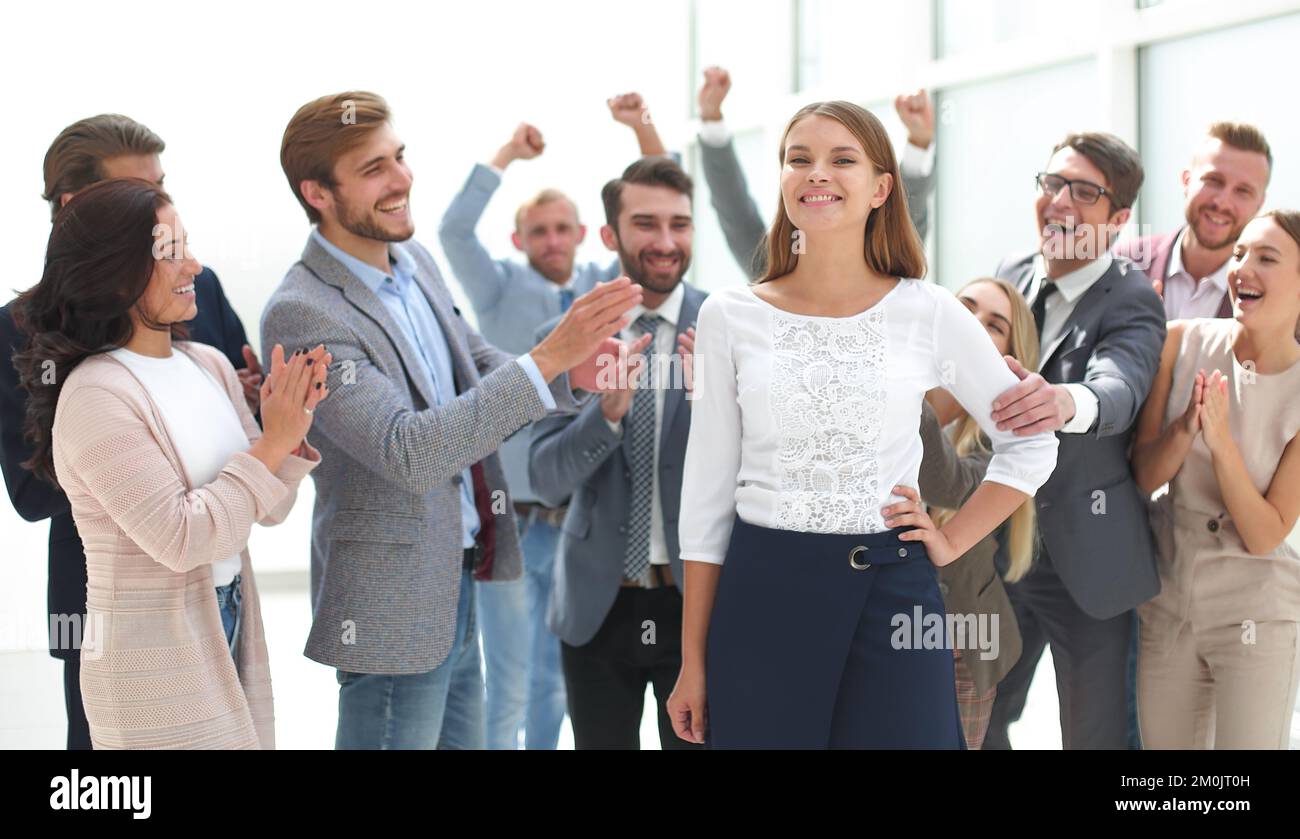 creative business team congratulating their young colleague Stock Photo ...