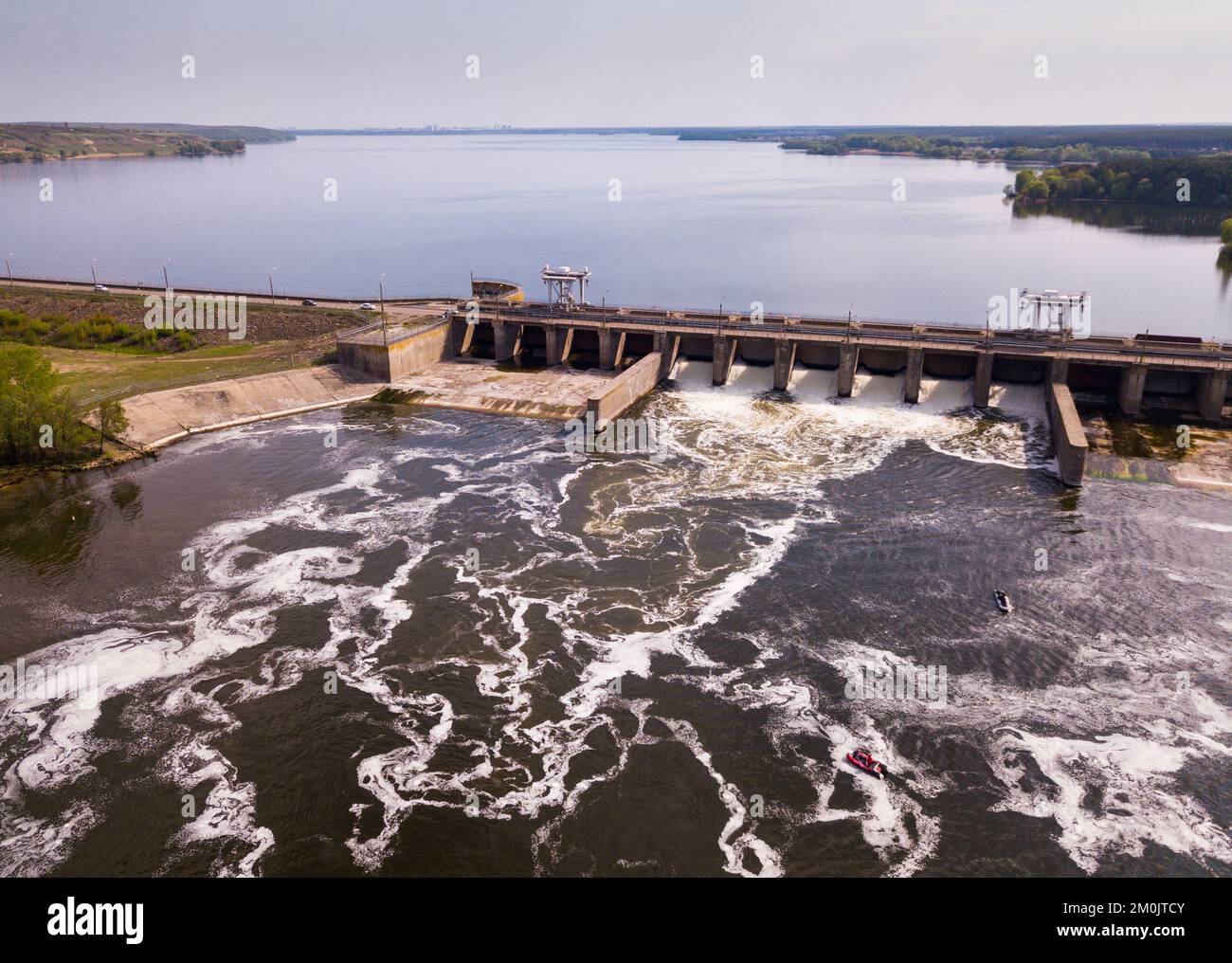 View of river with dam construction Stock Photo - Alamy