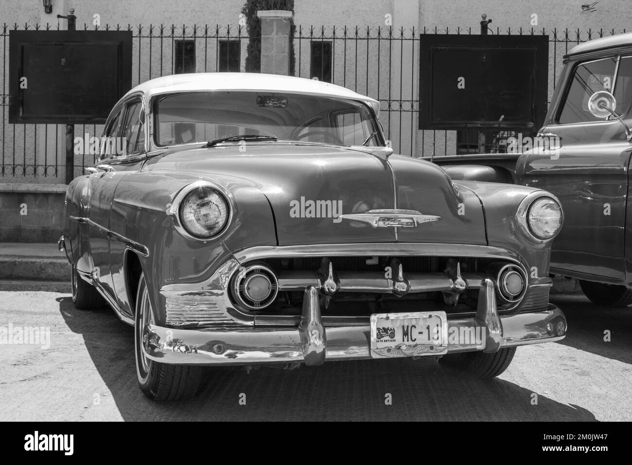 A grayscale shot of a Classic Chevrolet 210 displayed in a vintage car show in Tizayuca, Mexico Stock Photo