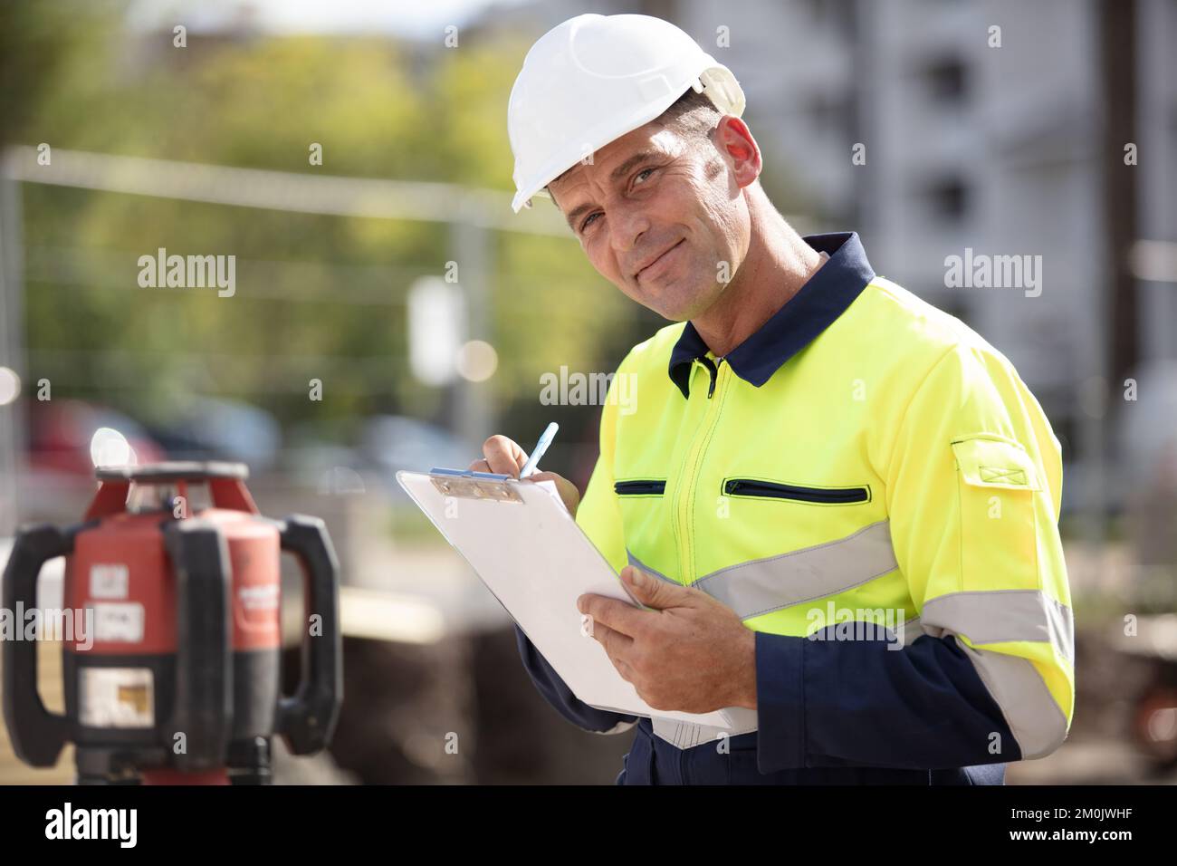 architect checking insulation during house construction Stock Photo