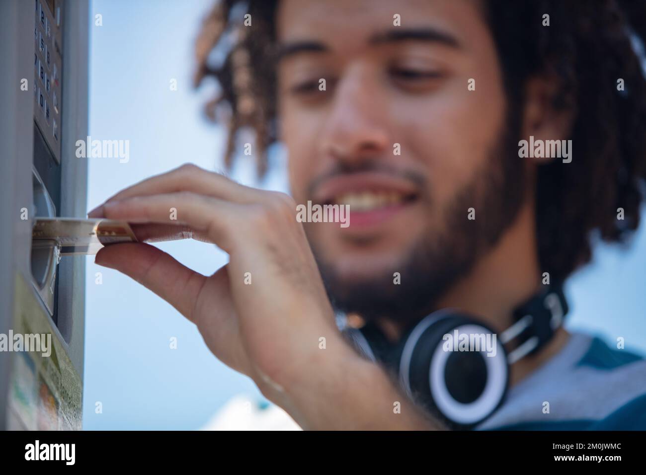 young-man-paying-for-car-parking-at-machine-stock-photo-alamy