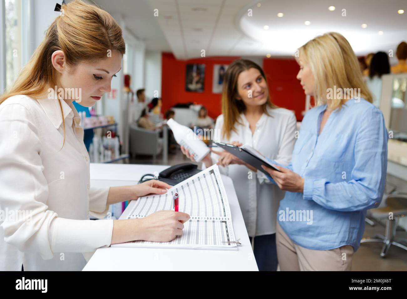 female receptionist working in beauty salon Stock Photo Alamy