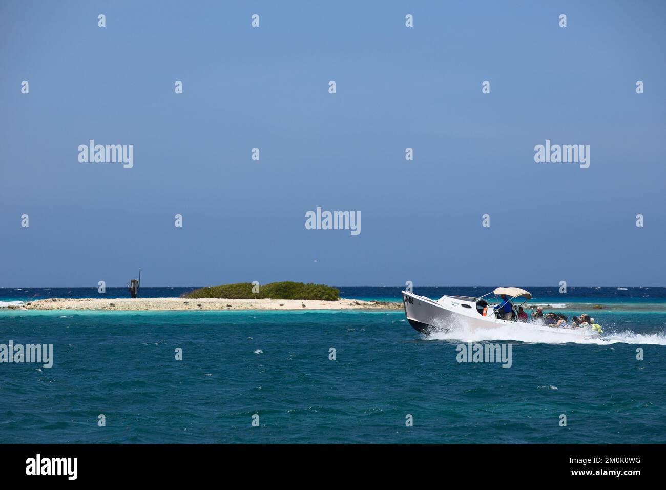 ORANJESTAD, ARUBA - JUNE 2, 2022: Water taxi taking guests to the private Renaissance island along Surfside beach in Oranjestad on Aruba Stock Photo