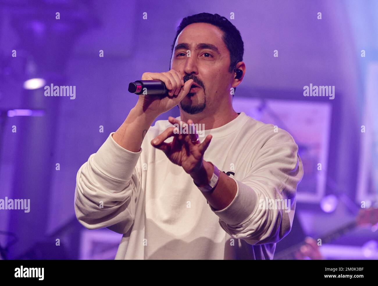 Hamburg, Germany. 06th Dec, 2022. Eko Fresh performs during the X-Mas Special of the initiative 'All Hands On Deck', a live fundraising concert of artists from different genres of the German music landscape, on stage at the restaurant 'Bullerei'. Credit: Georg Wendt/dpa/Alamy Live News Stock Photo