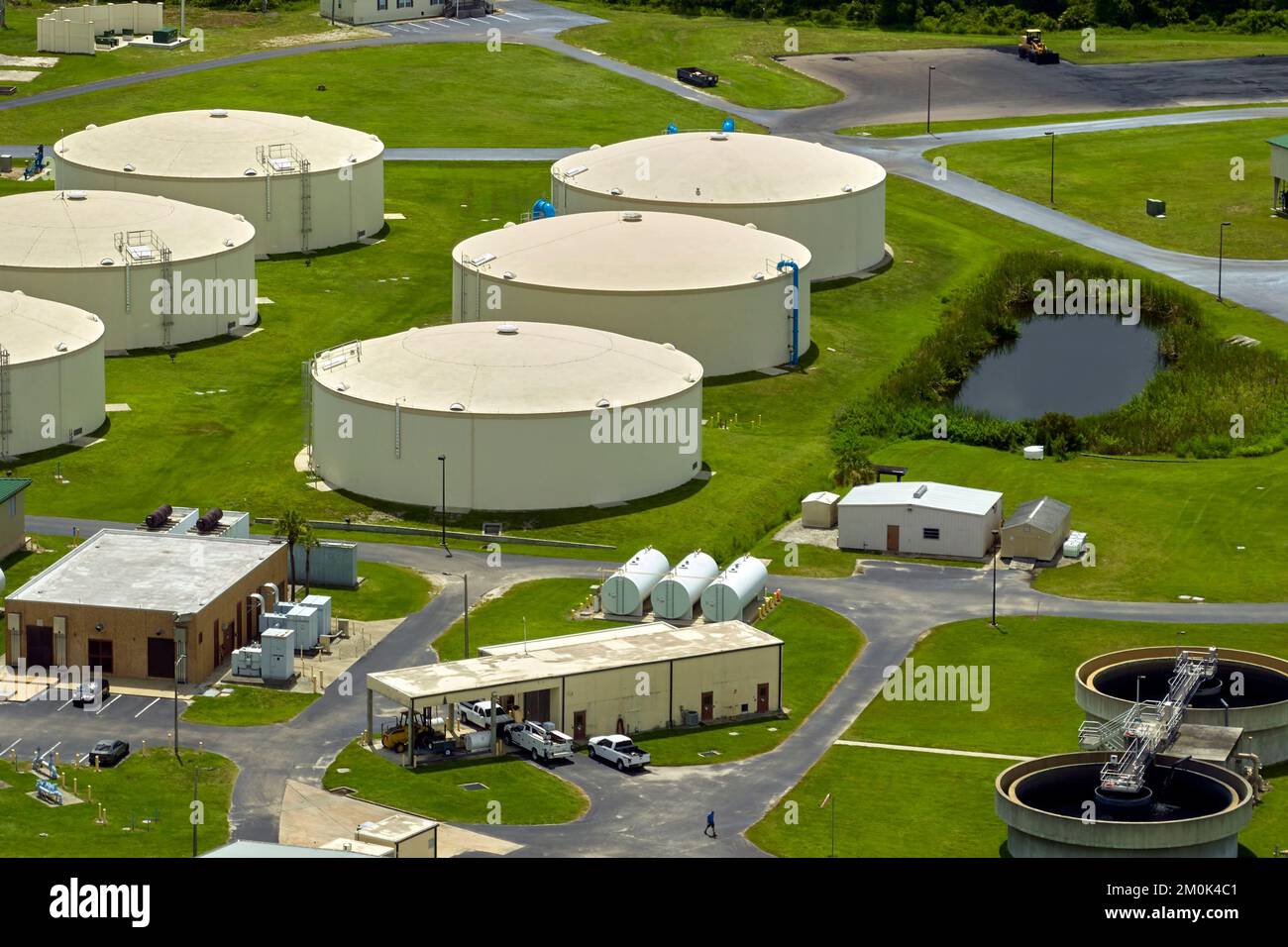 Aerial view of modern water cleaning facility at urban wastewater treatment plant. Purification process of removing undesirable chemicals, suspended Stock Photo