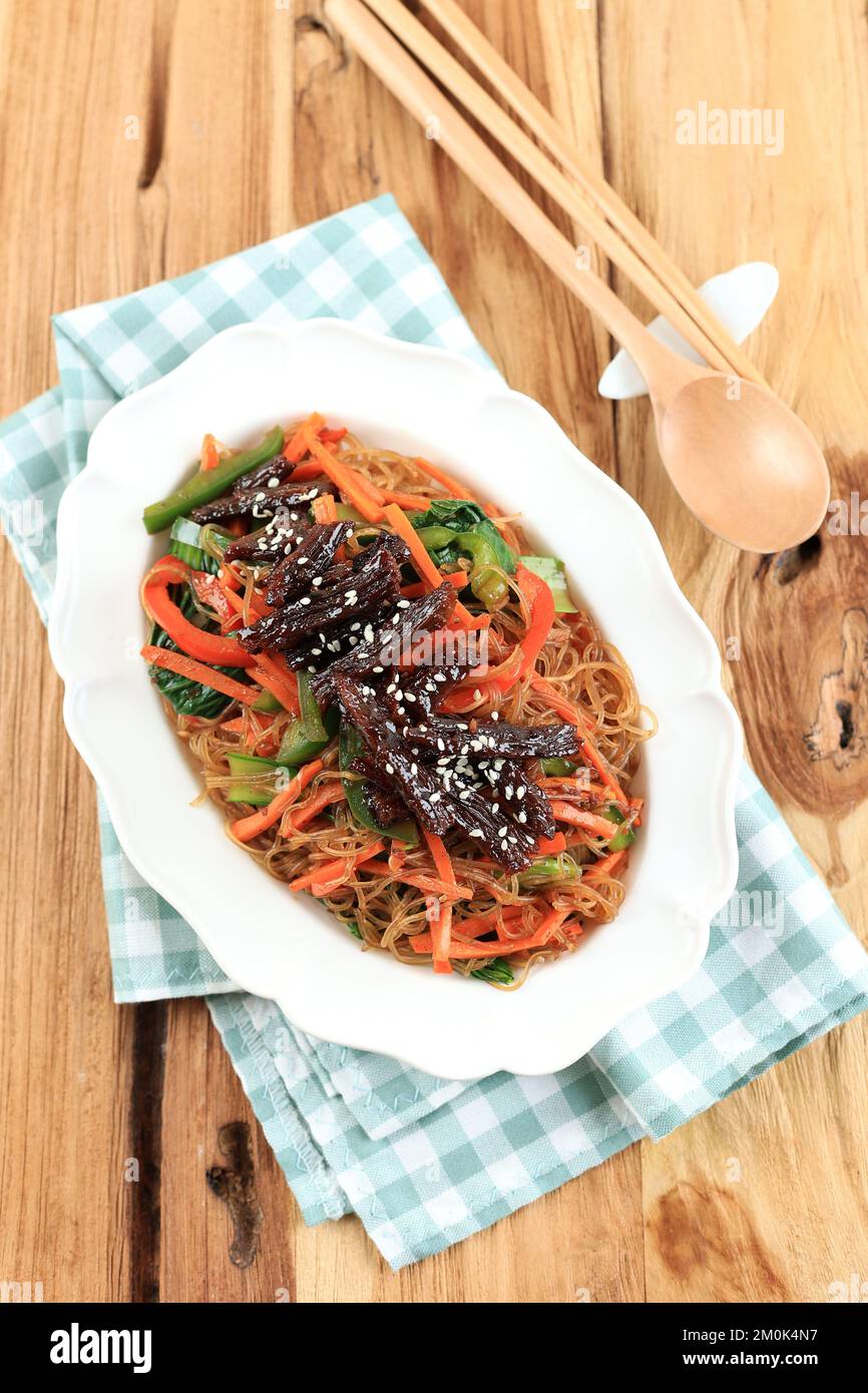 Top View Korean Japchae Bulgogi, Stir Fried Vermicelli with Carrot and Bell Pepper Stock Photo