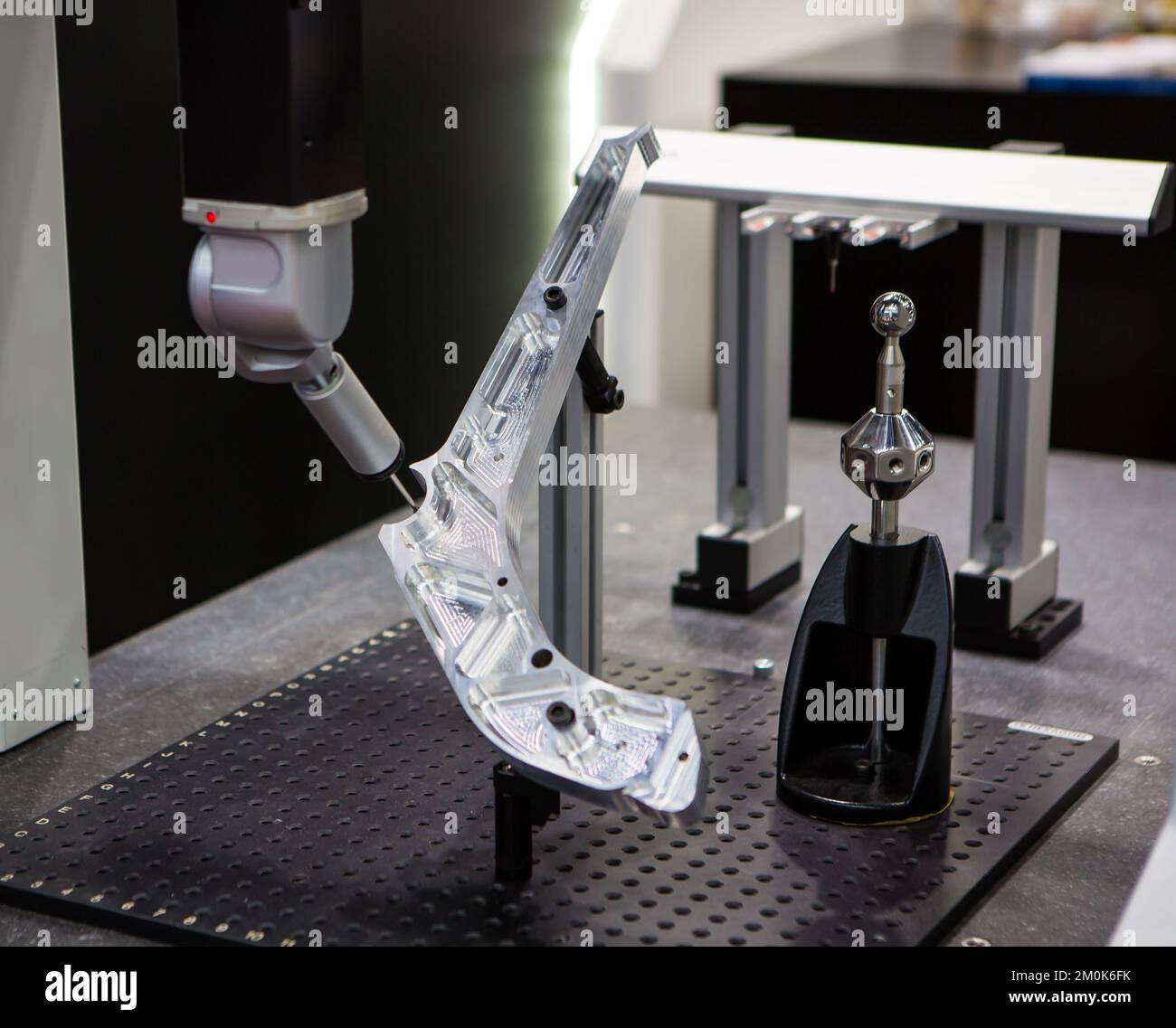 CMM Coordinate Measuring Machine probe measuring workpiece in