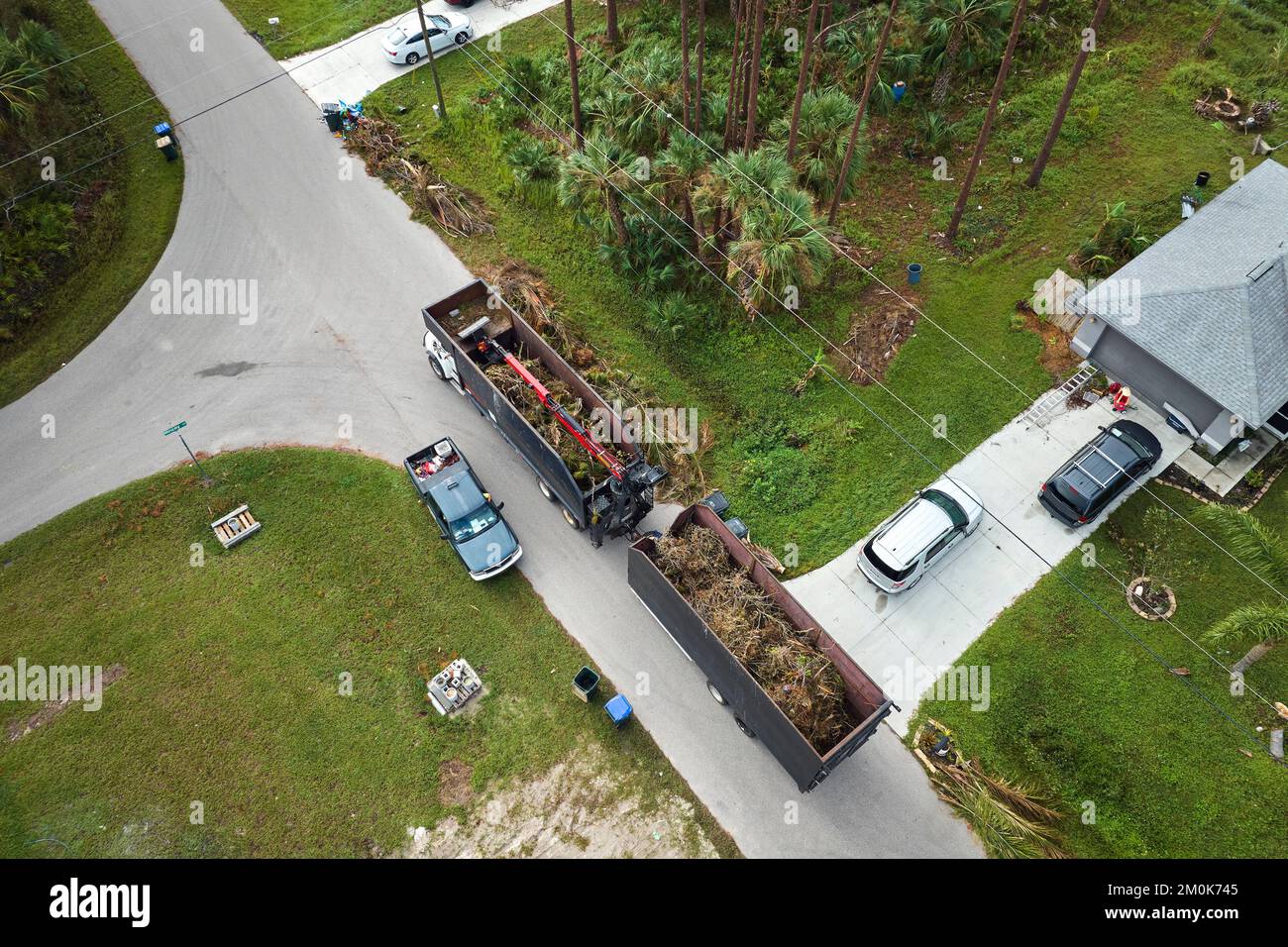 Top view of Hurricane Ian special aftermath recovery dump truck picking
