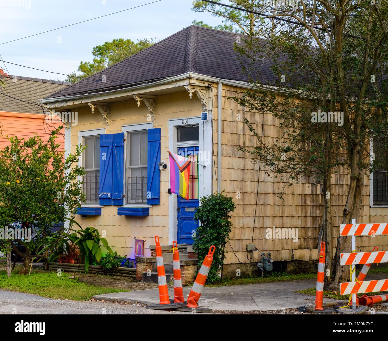 NEW ORLEANS, LA, USA - NOVEMBER 20, 2022: Front of historic shotgun house displaying gay pride flag in Carrollton Neighborhood Stock Photo
