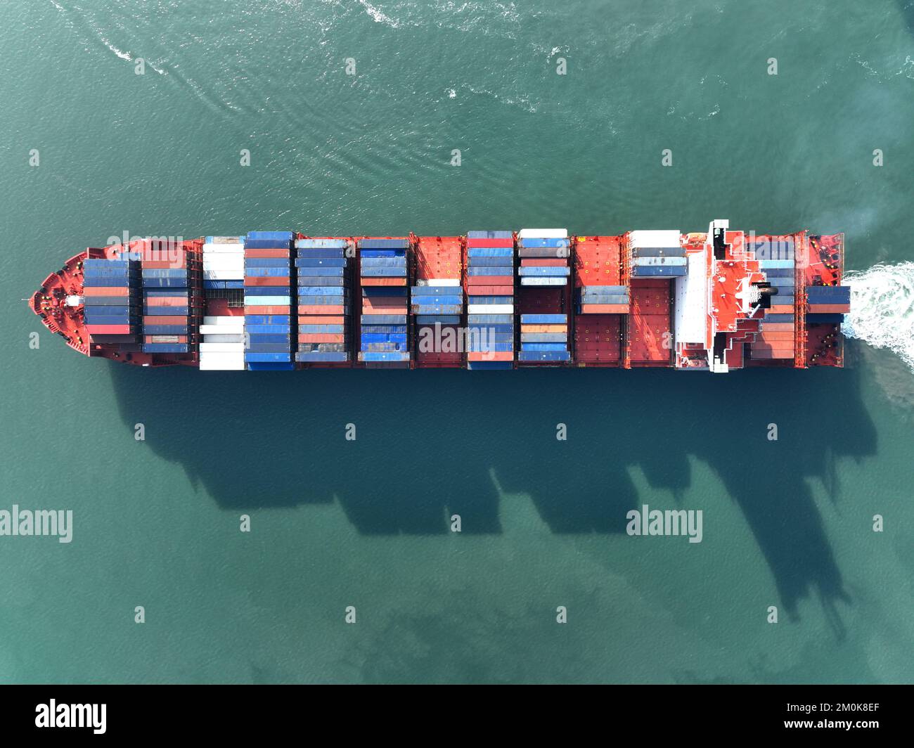 LIANYUNGANG, CHINA - DECEMBER 7, 2022 - Cargo ships dock at their ...