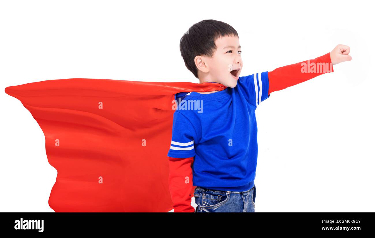 Happy kid in red super hero cape and mask Stock Photo
