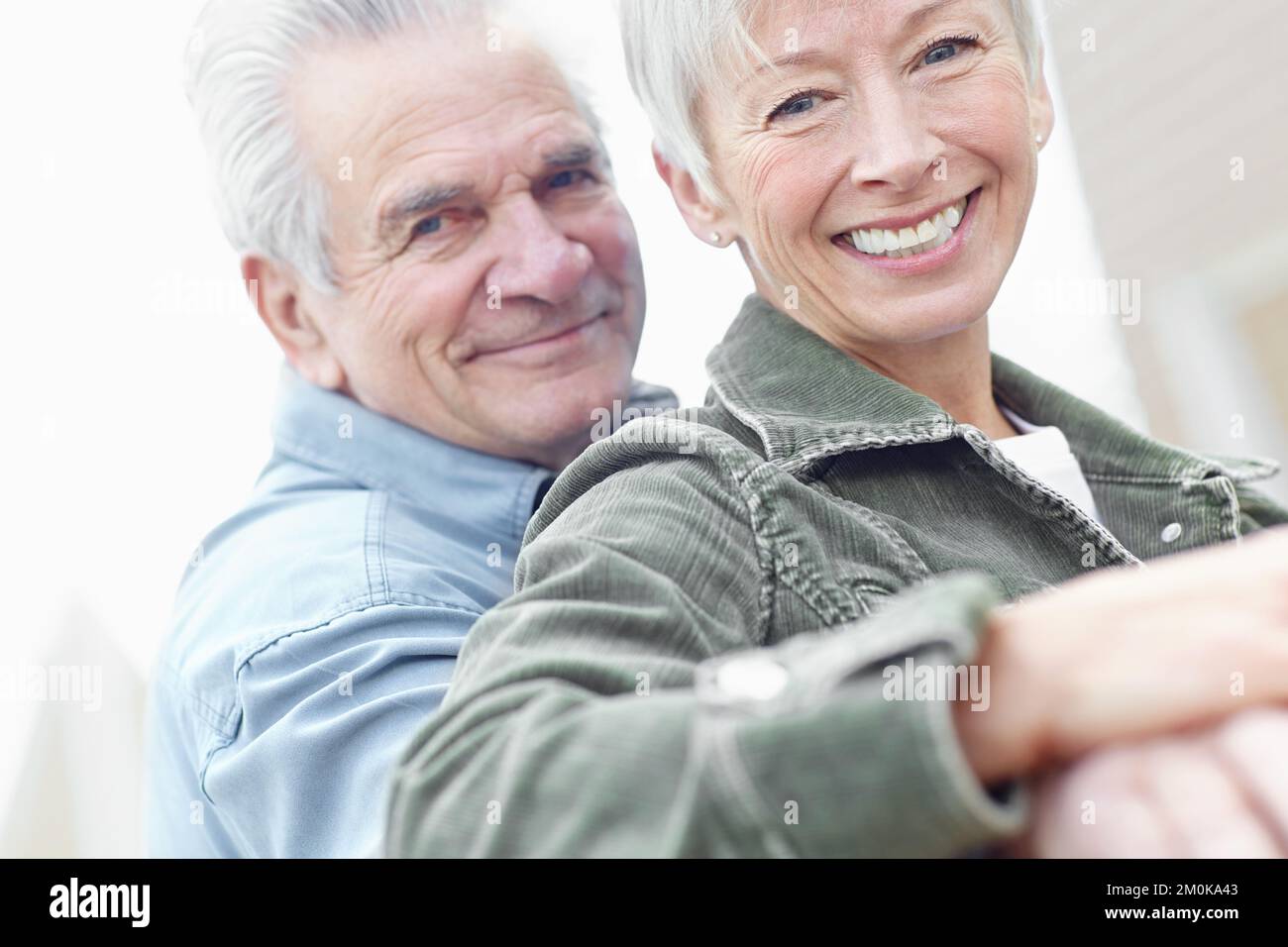 Having a fantastic time together. Cropped image of a mature husband and wife sitting together on a bench. Stock Photo