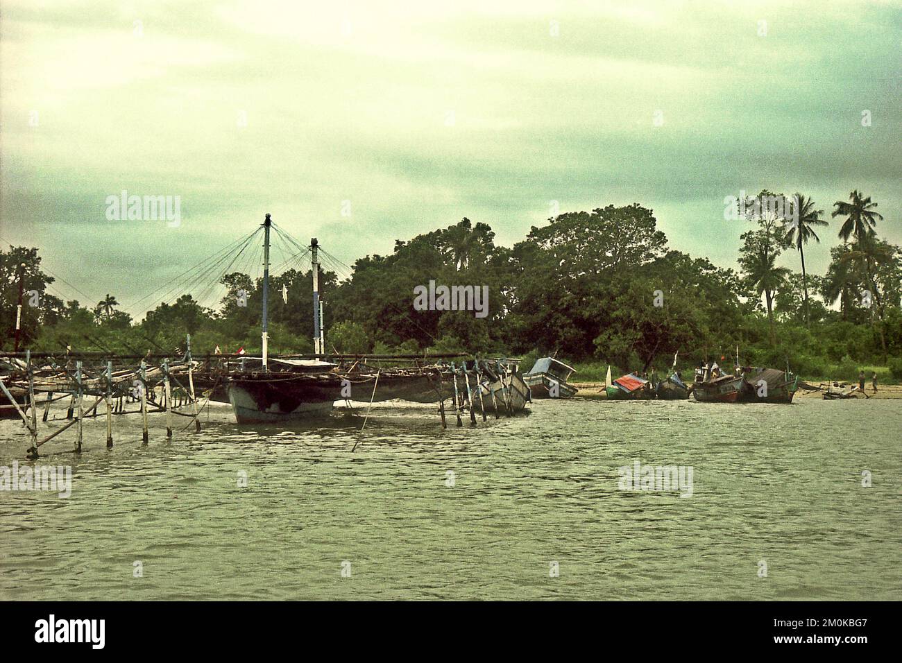 A sailing bagan (bagang perahu) in a background of sandy beach in Sumur