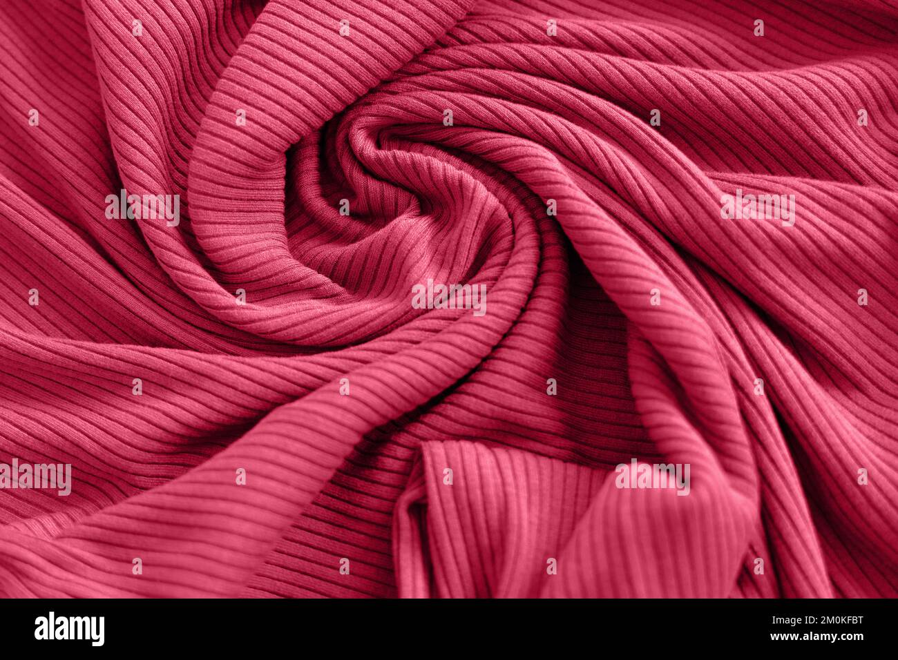 Viva magenta color of the year 2023, ribbed texture of cloth. Fabric