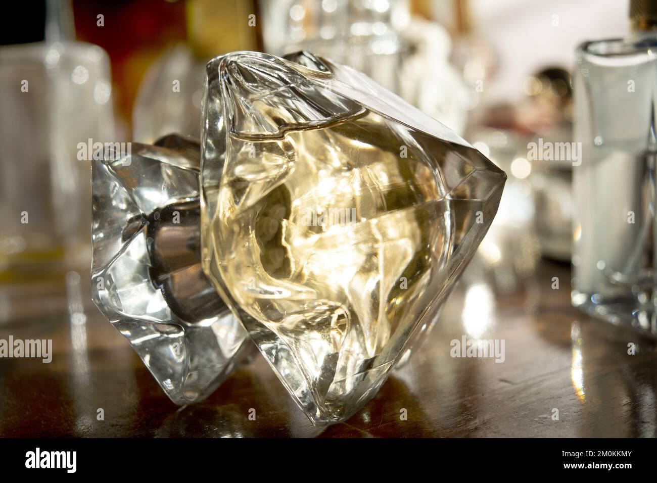 perfume bottles with reflections of lights and colors Stock Photo