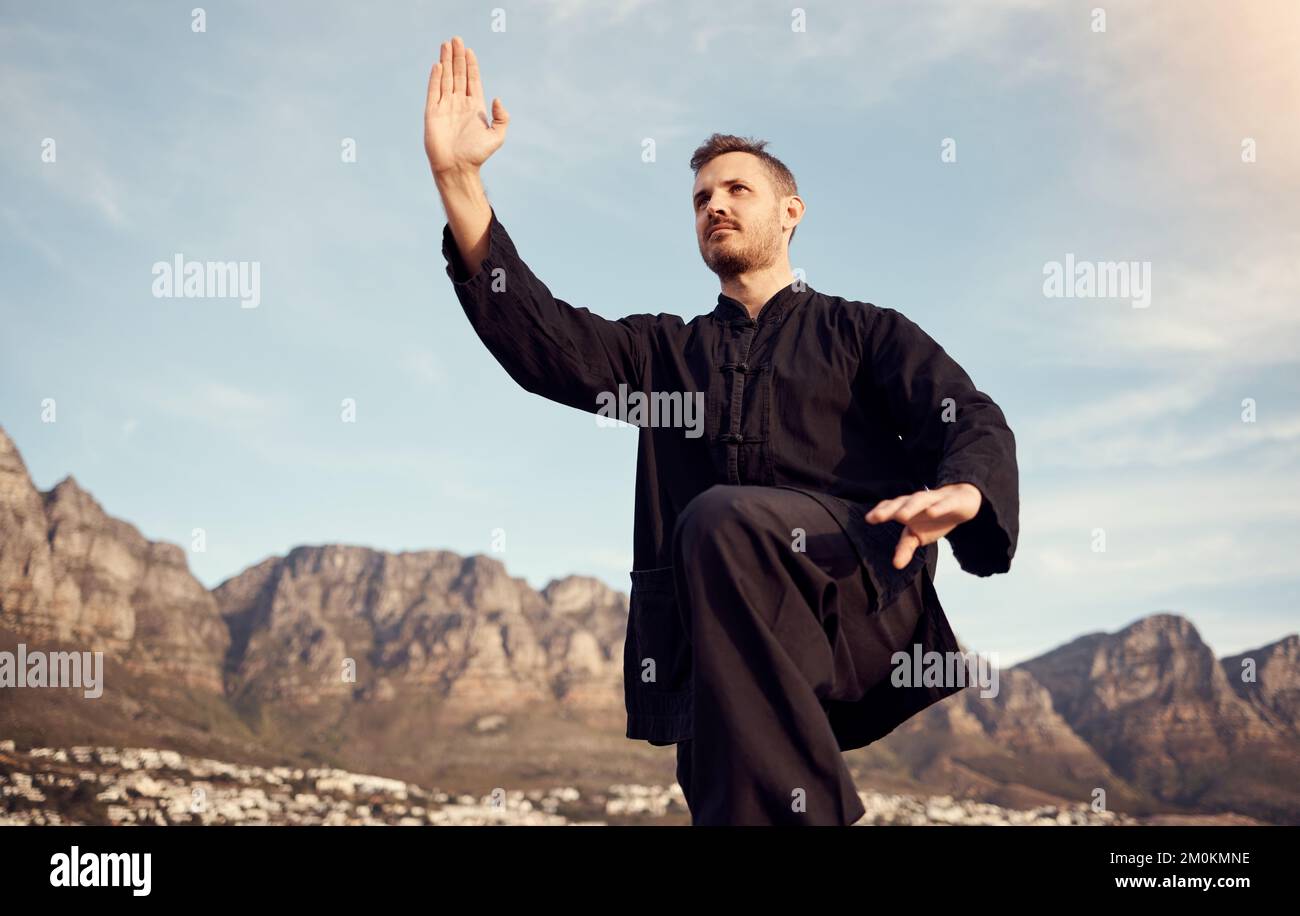 Tai chi, martial arts and fitness outdoor, man does karate and sport motivation, body training