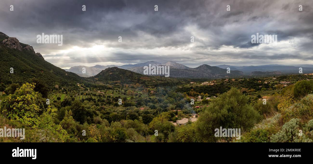 Farms and green fields with Mountain Landscape. Dorgali, Sardinia, Italy. Stock Photo