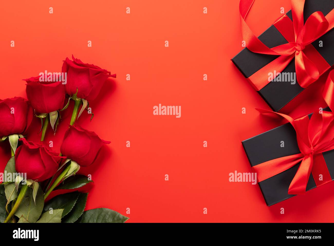 Valentines day card with gift boxes and rose flowers. On red background ...
