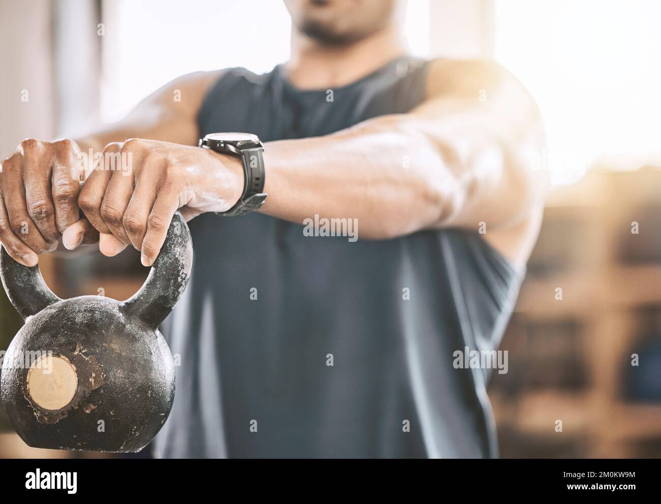 Bodybuilder lifting weights for arm muscles. Strong arms come from