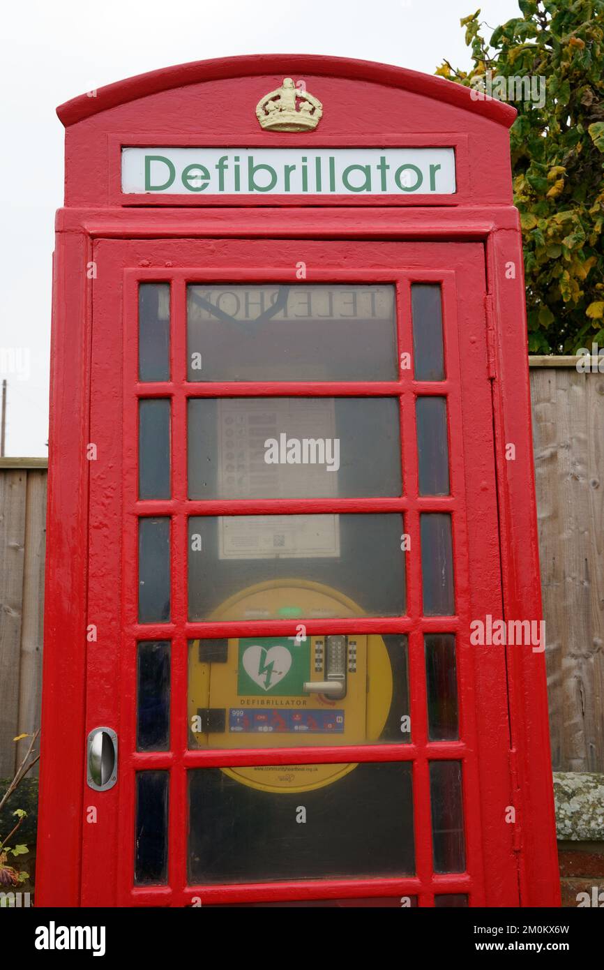 Public Access Defibrillator in old phone box, Stubton, Lincolnshire Stock Photo