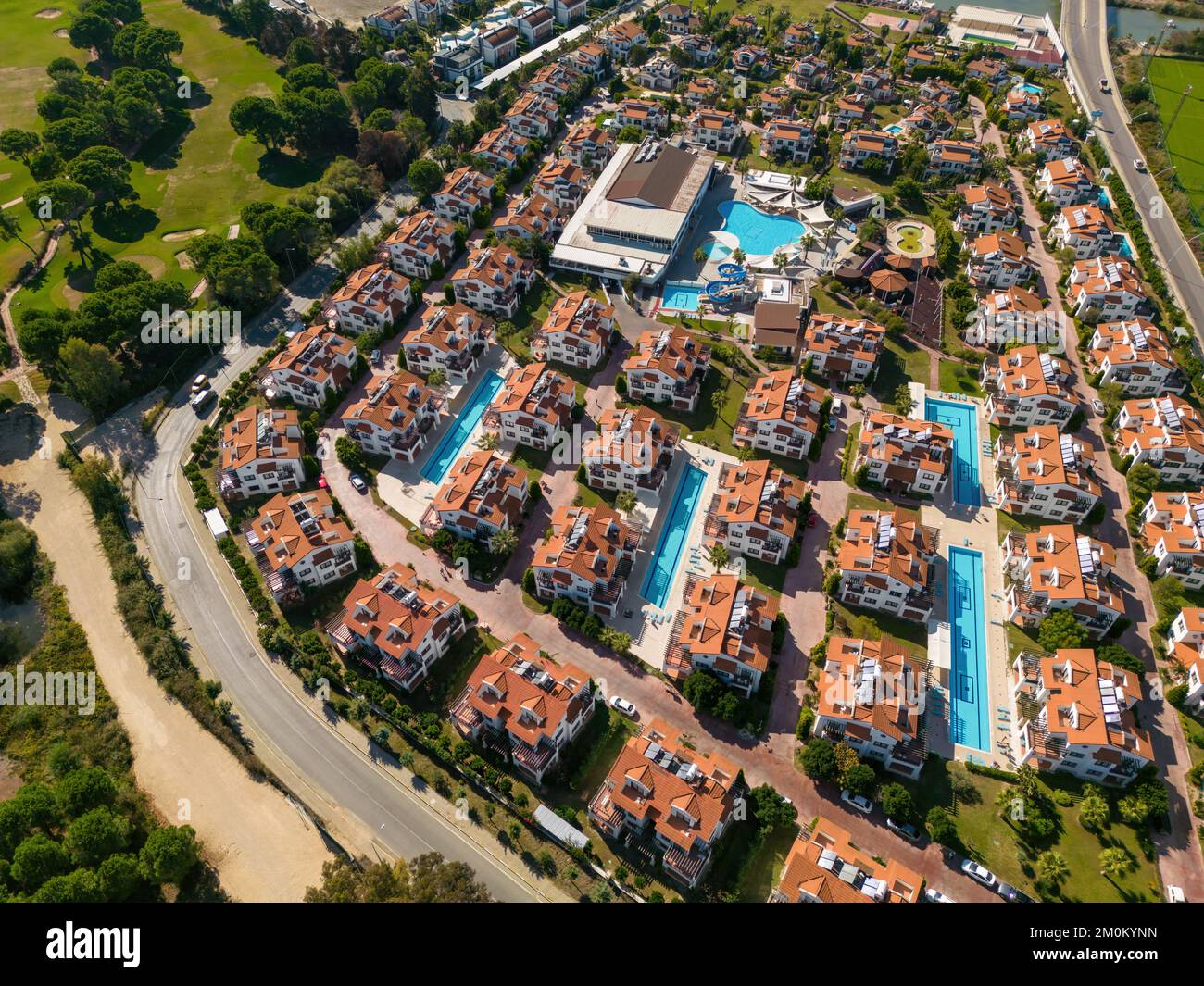 View of Resort consisting of villas with pools built next to the golf course ...