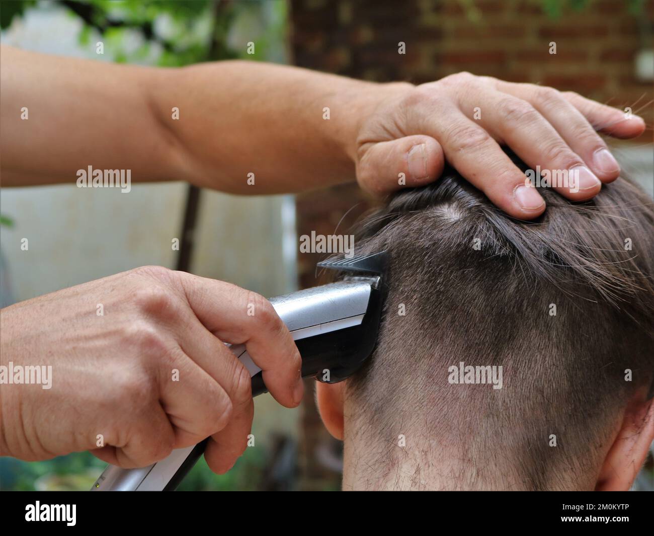 Cutting off hair hi-res stock photography and images - Alamy