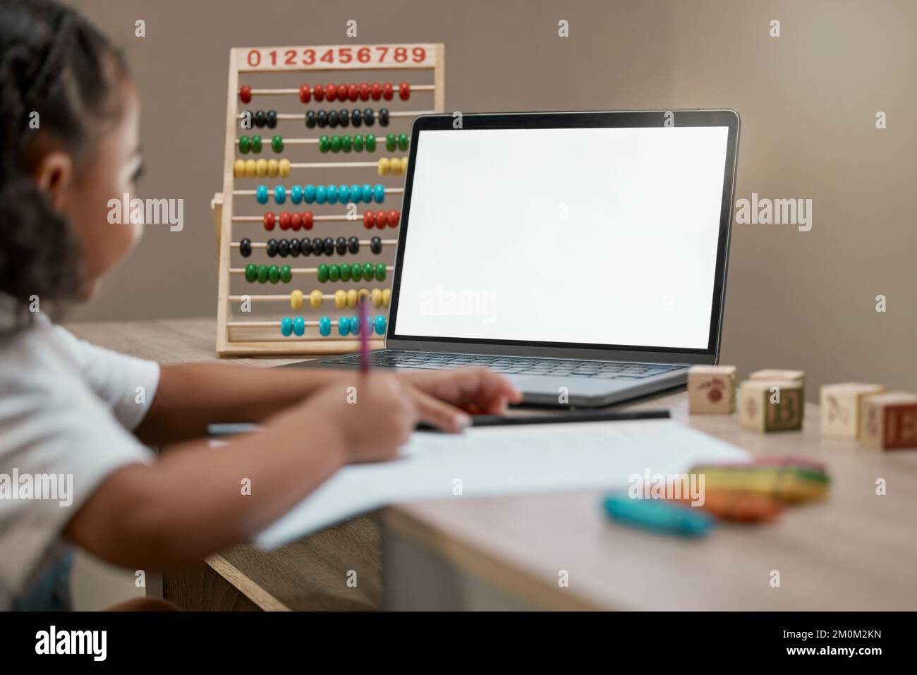 Child, blank laptop and homework for distance learning and online education during math lesson. Abacus, pc and elearning with a little girl streaming Stock Photo