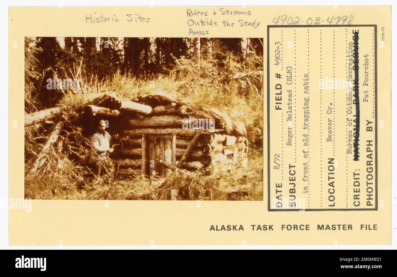 Roger Bolstead (BLM) in front of old trapping cabin. Alaska Task Force