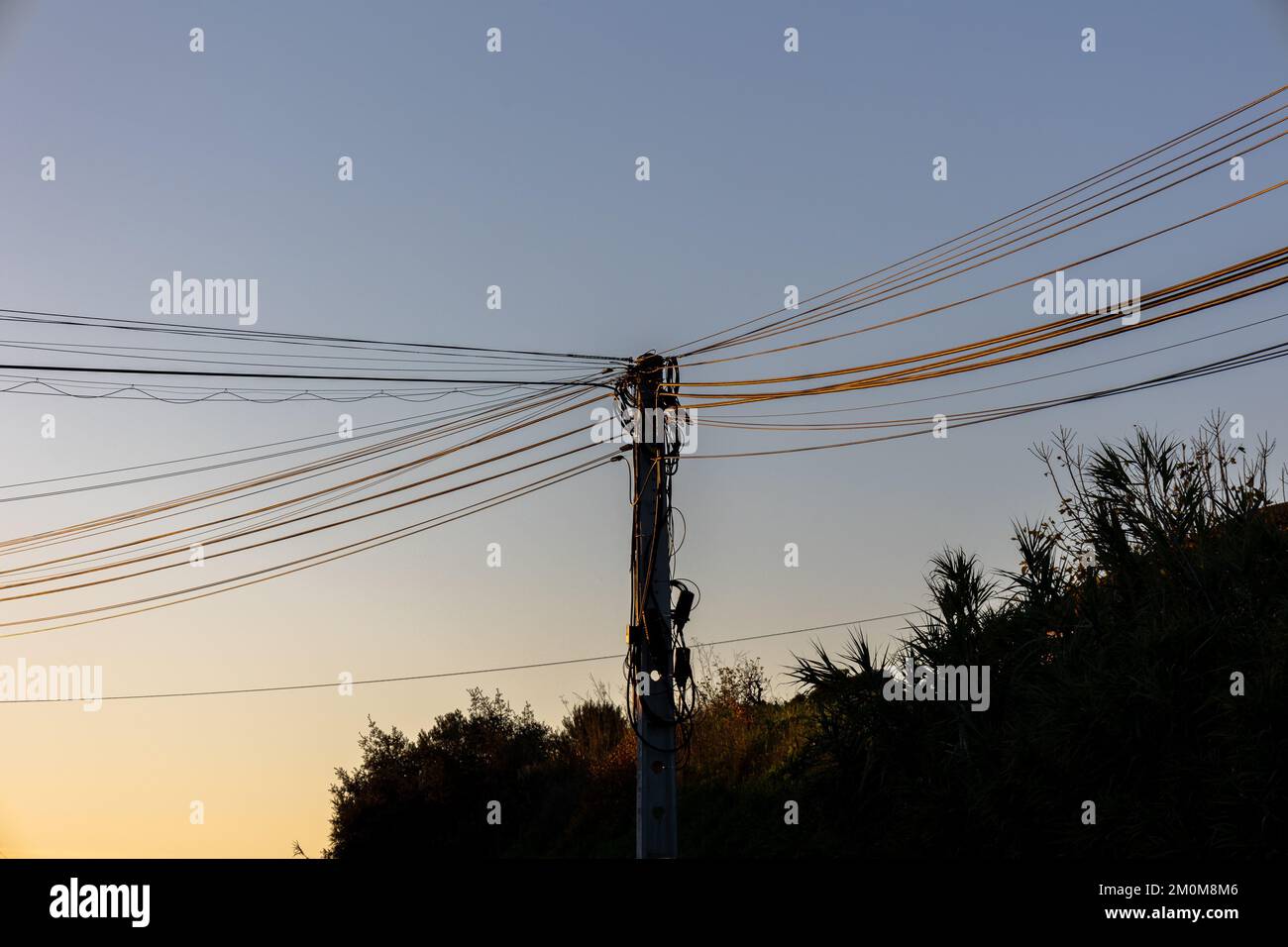 Upper country power lines photographed in evening mood Stock Photo