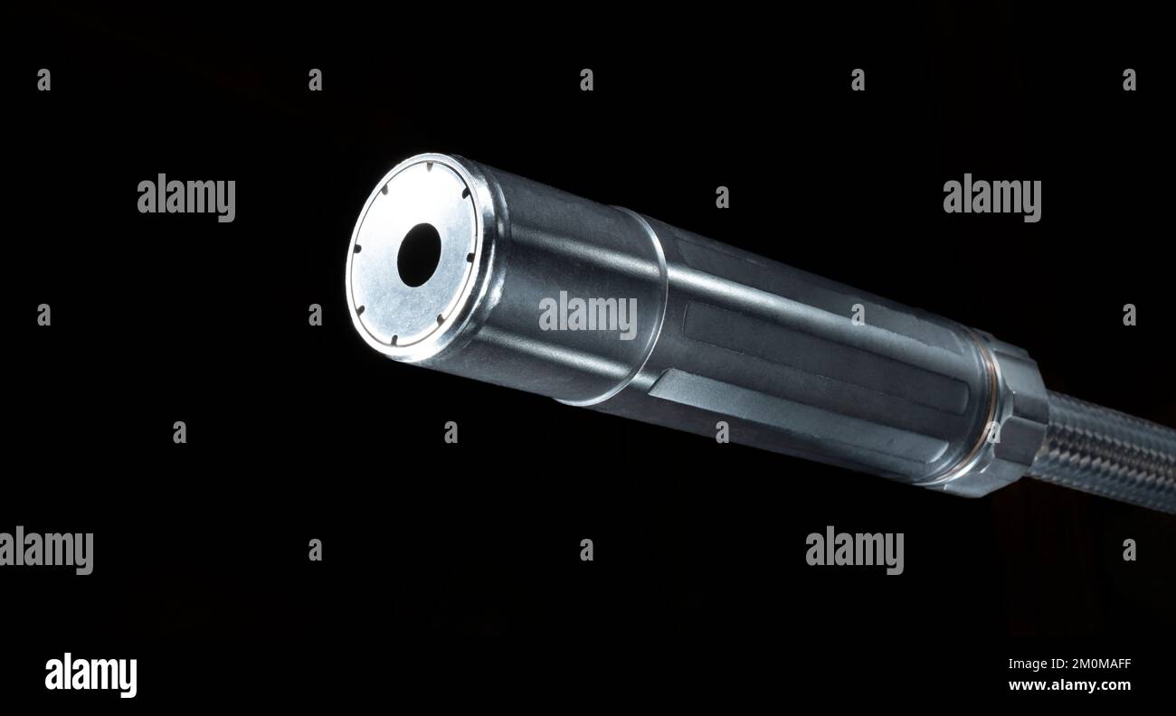 Silencer mounted on a rifle barrel with copy space Stock Photo - Alamy