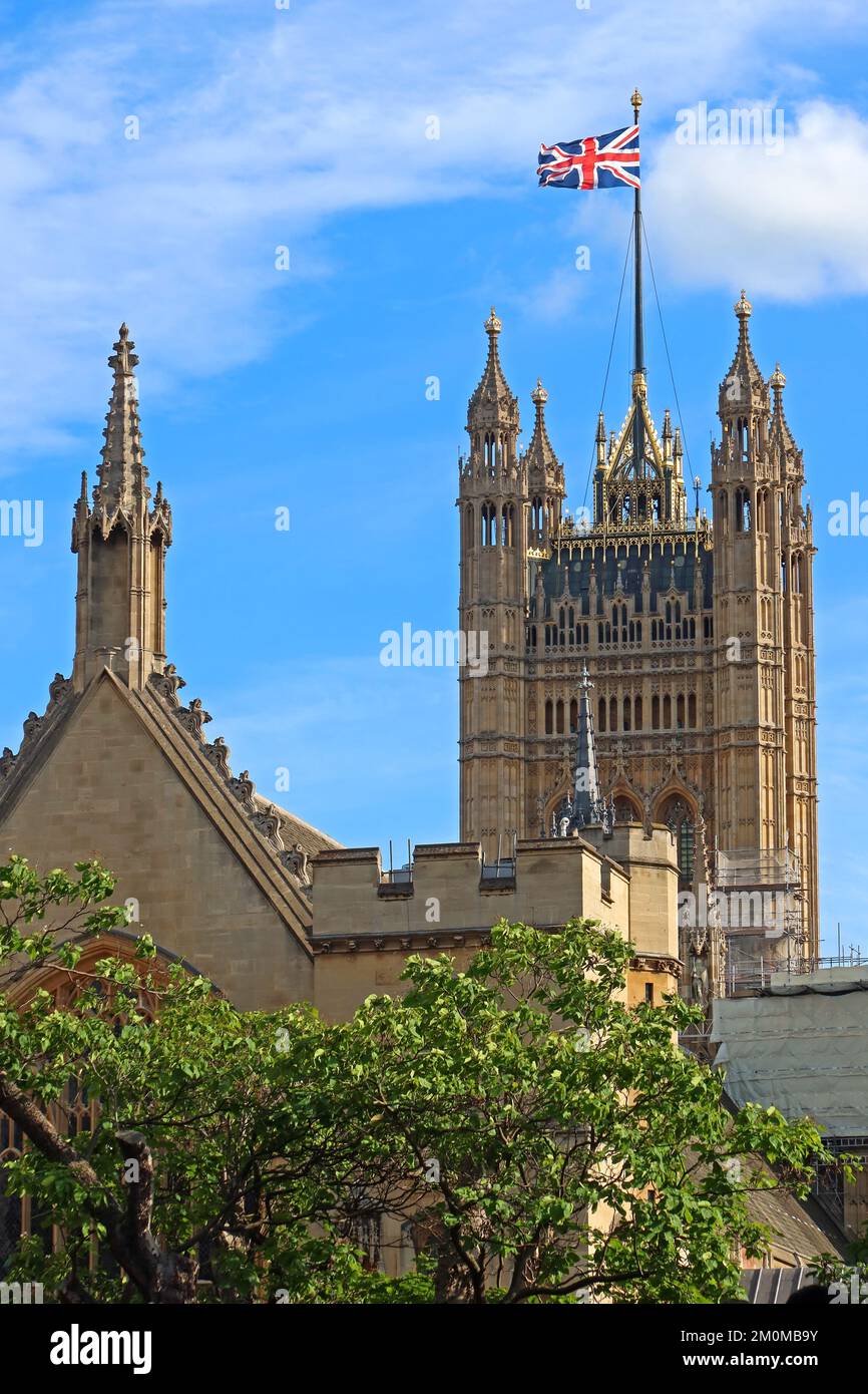 Big Ben clock and houses of parliament, union flag, British seat of government, Westminster, London, England, UK, SW1A 0AA Stock Photo