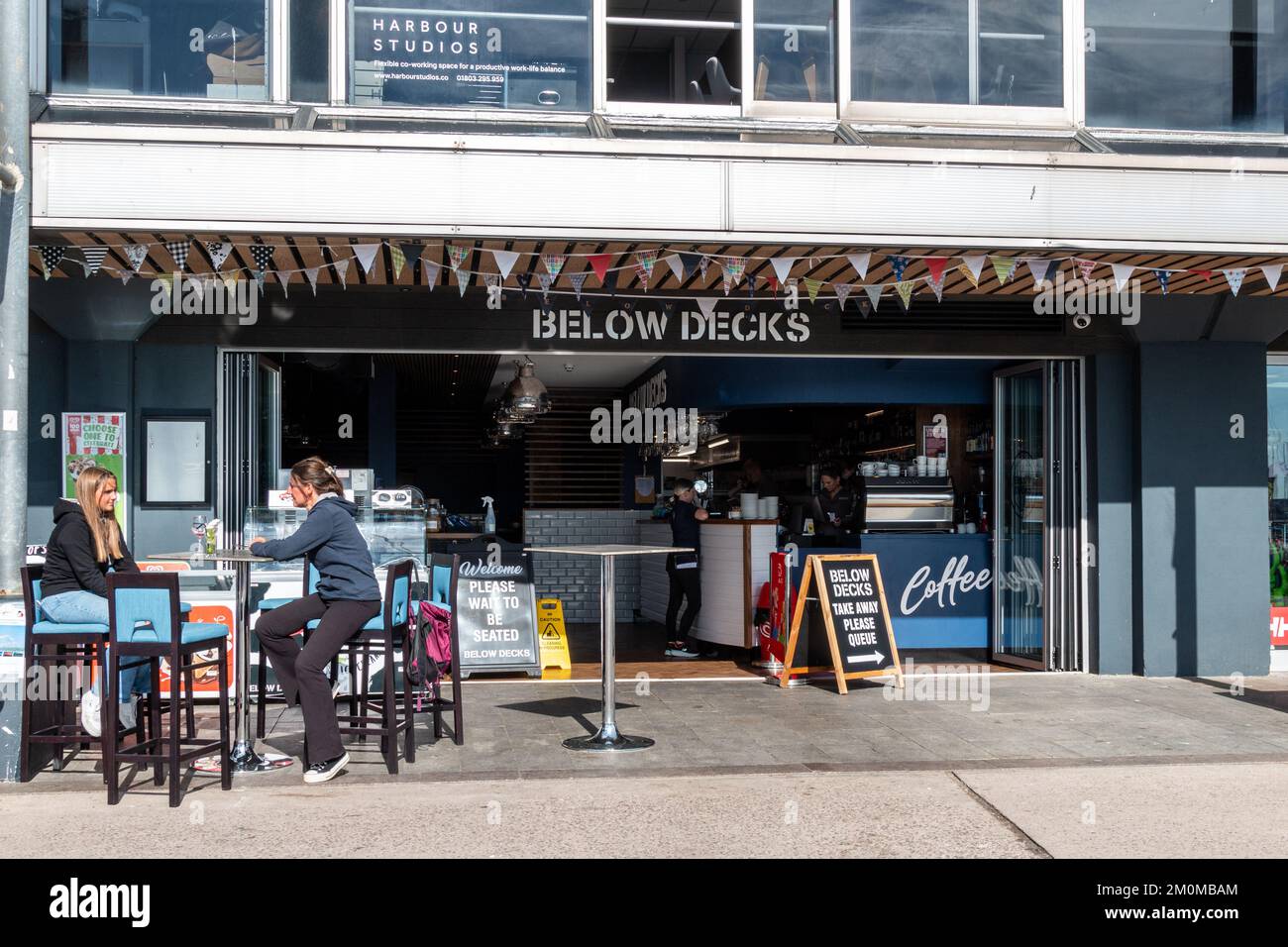 The Below Decks cafe and bar overlooking Torquay Harbour, Devon, UK Stock Photo