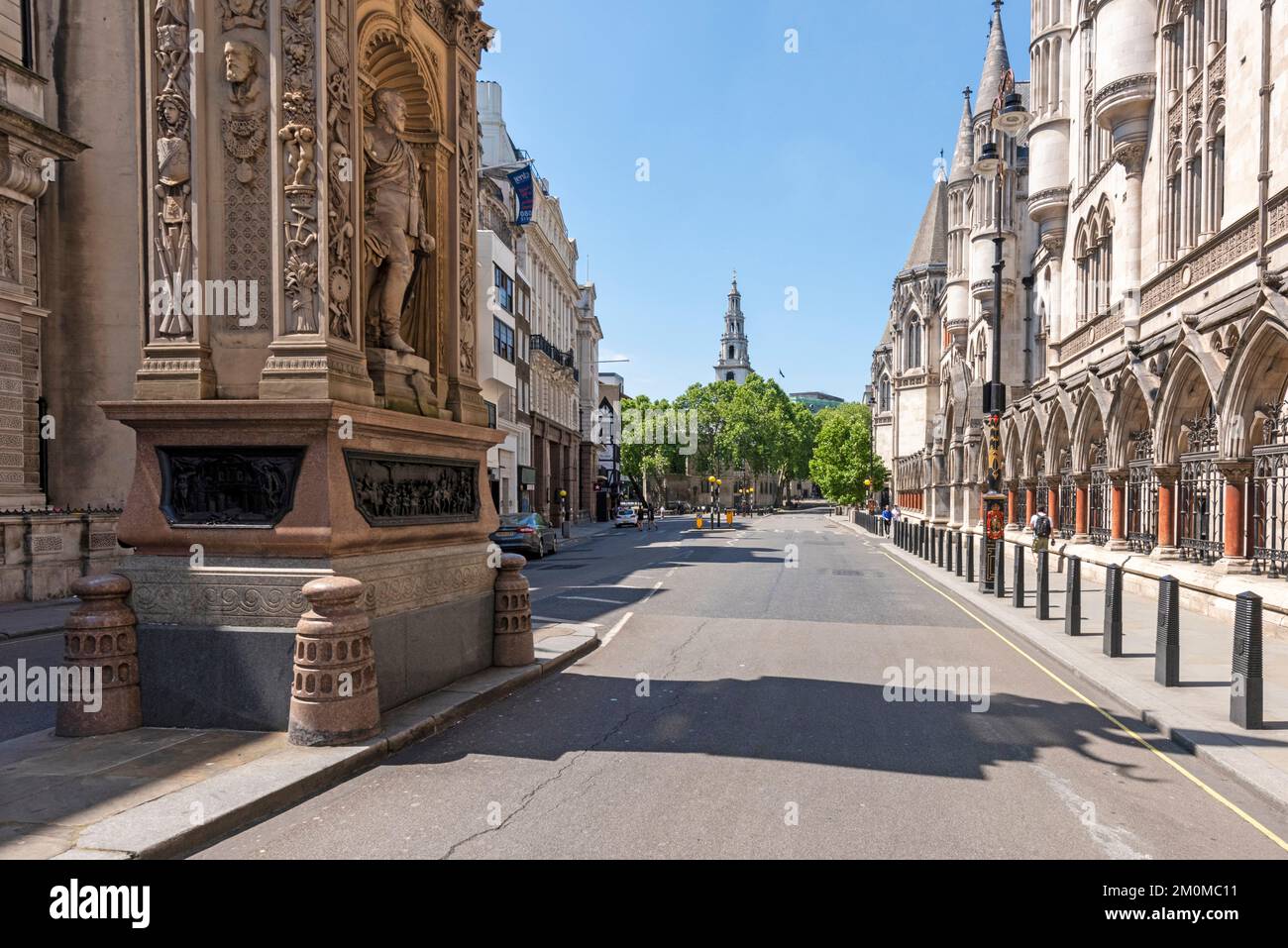 A shot looking West along the Strand, Temple Bar Memorial, The Royal Courts of Justice and St Clement Danes Church all in shot. Taken during Lockdown . Stock Photo
