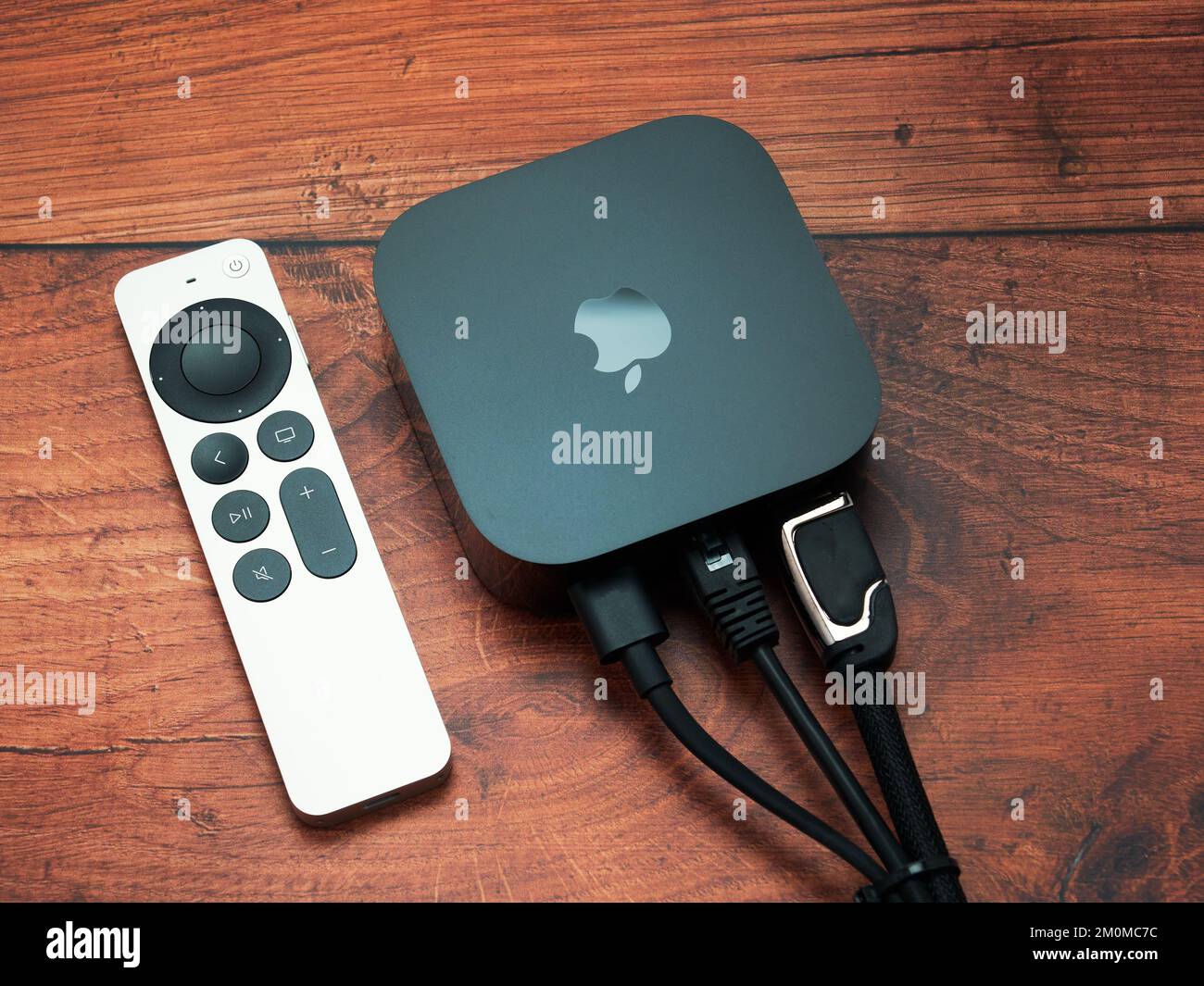 Bucharest, Romania - December 4, 2022: Product shot of the Apple TV 4k 2022  with WiFi and Ethernet, 128Gb RAM, and with Siri Remote, on oak wood backg  Stock Photo - Alamy