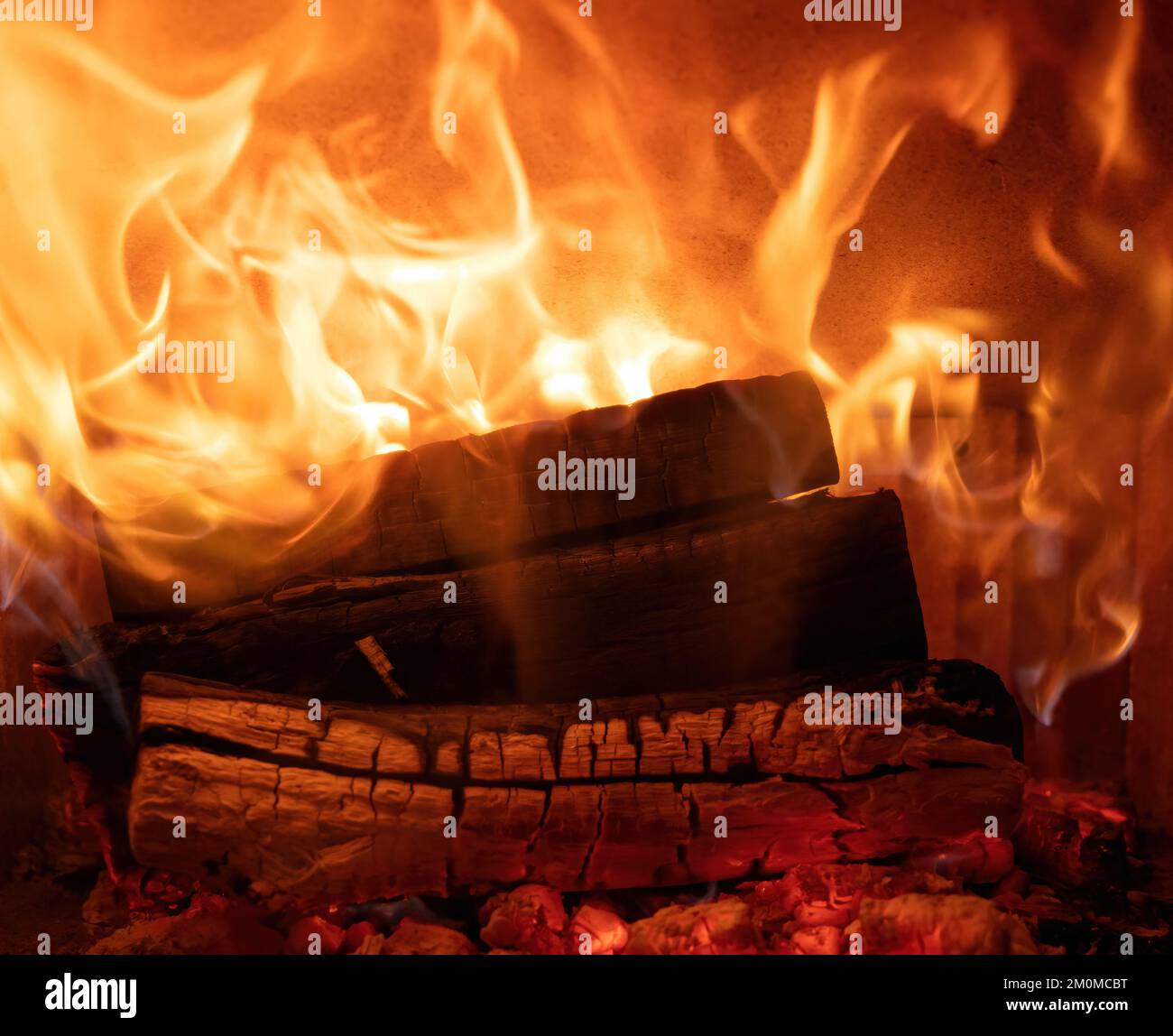 Fire flames and burning wood logs, fireplace close up, Warm home in