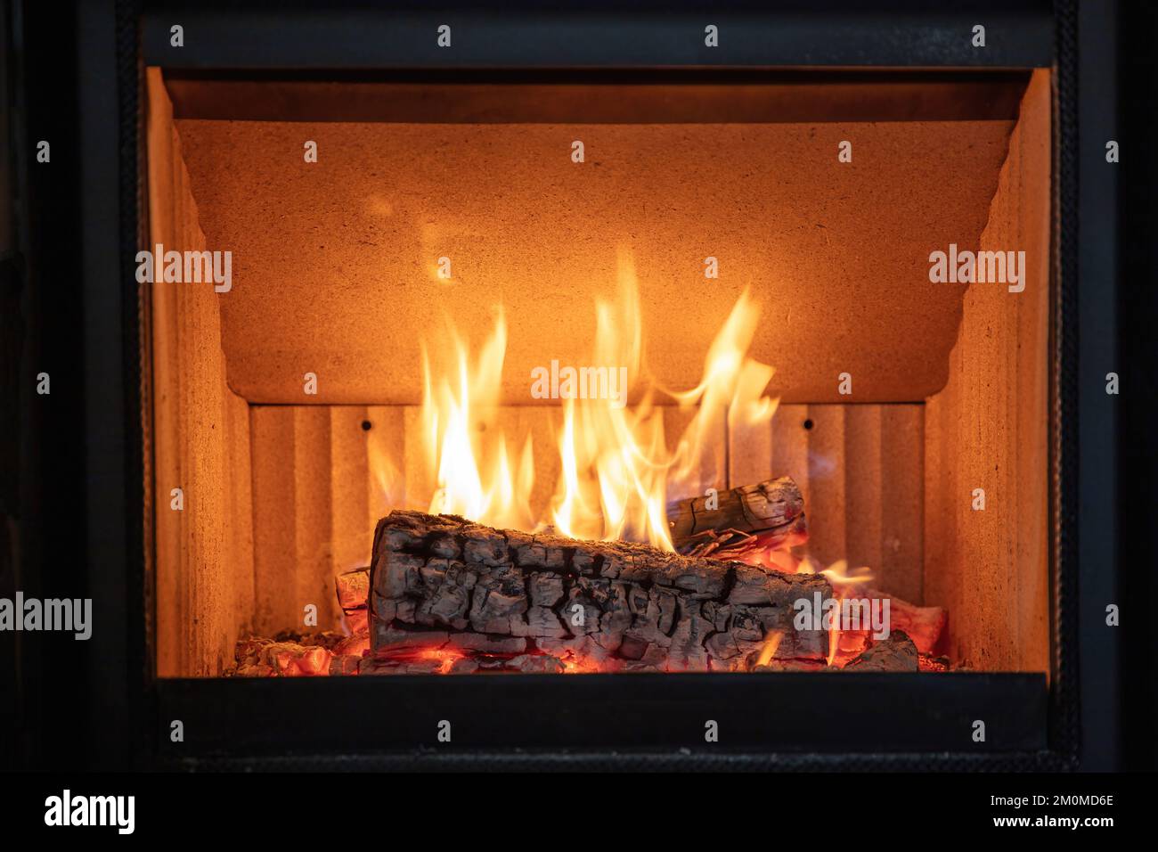 Fire flames and burning wood logs, energy stove fireplace close up