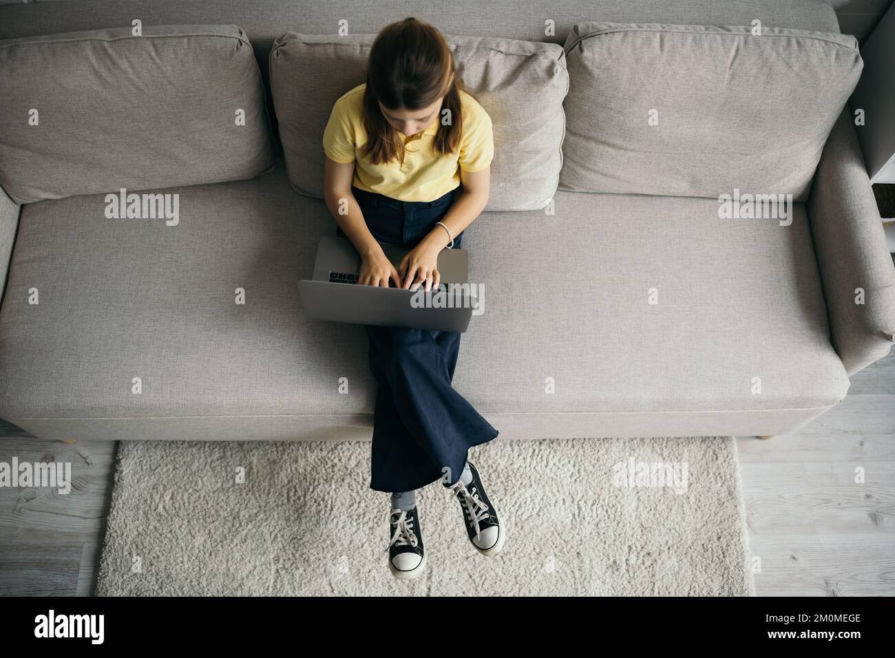 Preteen girl using laptop hi-res stock photography and images - Alamy