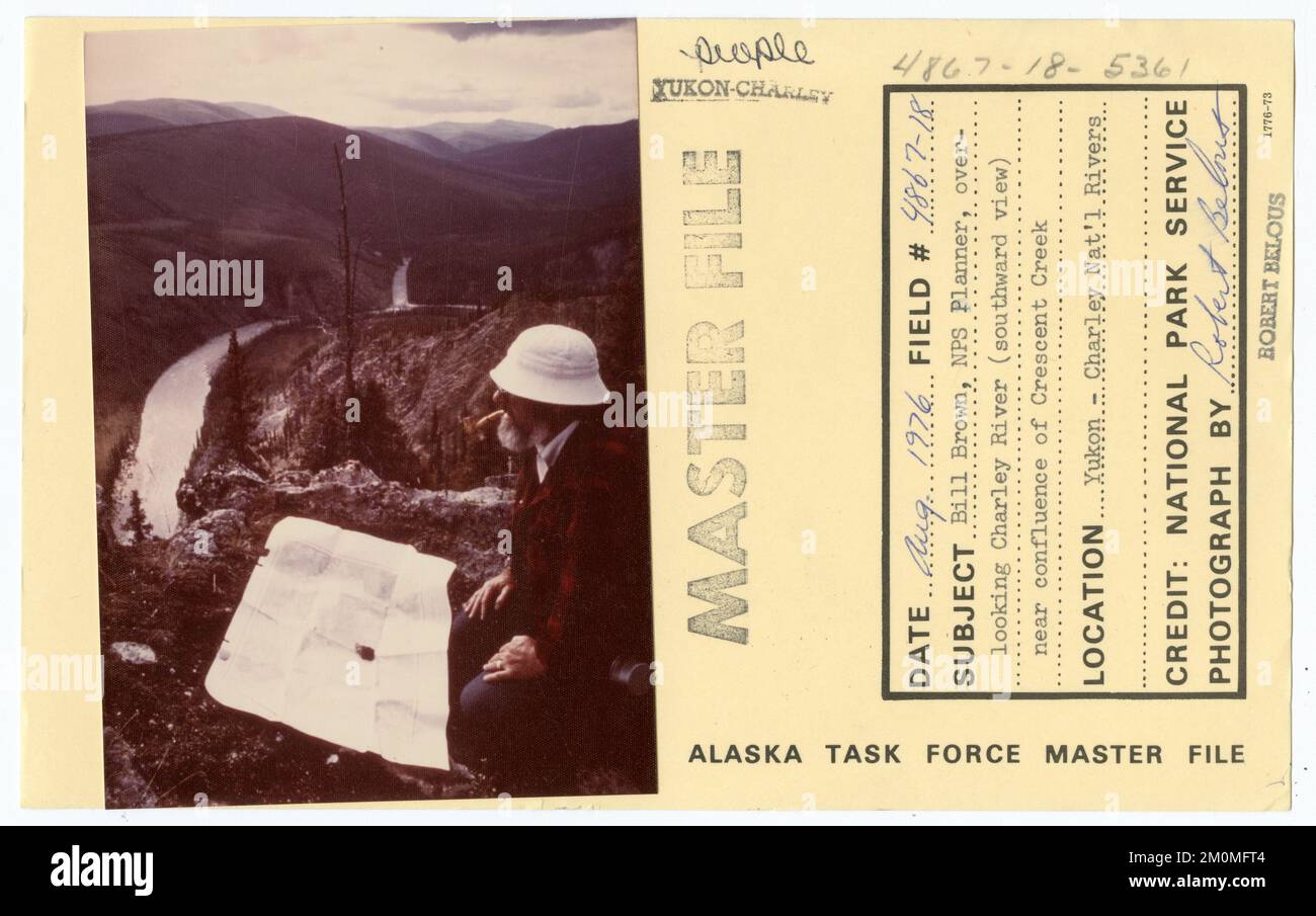 Bill Brown, NPS Planner, over-looking Charley River (southward view) near confluence of Crescent Creek. Alaska Task Force Photographs Stock Photo