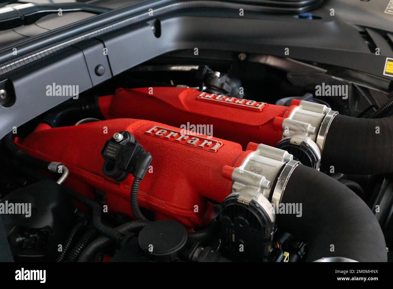 A Ferrari Portofino Engine bay with red engine covers with Ferrari ...