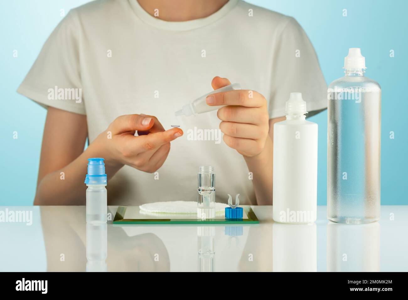 Night Contact Lens Care. Oftalmology composition, boy clean contact lenses with cleansing