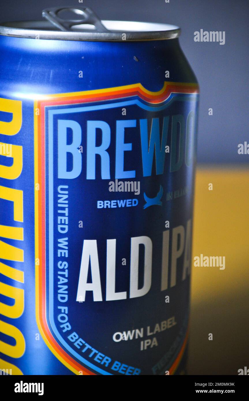 An empty can of Brewdog ALD IPS beer isolated against a yellow background Stock Photo