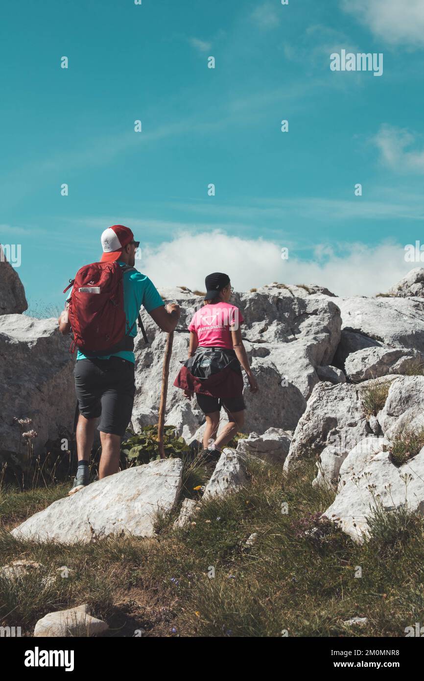 Woman climbing steep rocky hi-res stock photography and images - Alamy