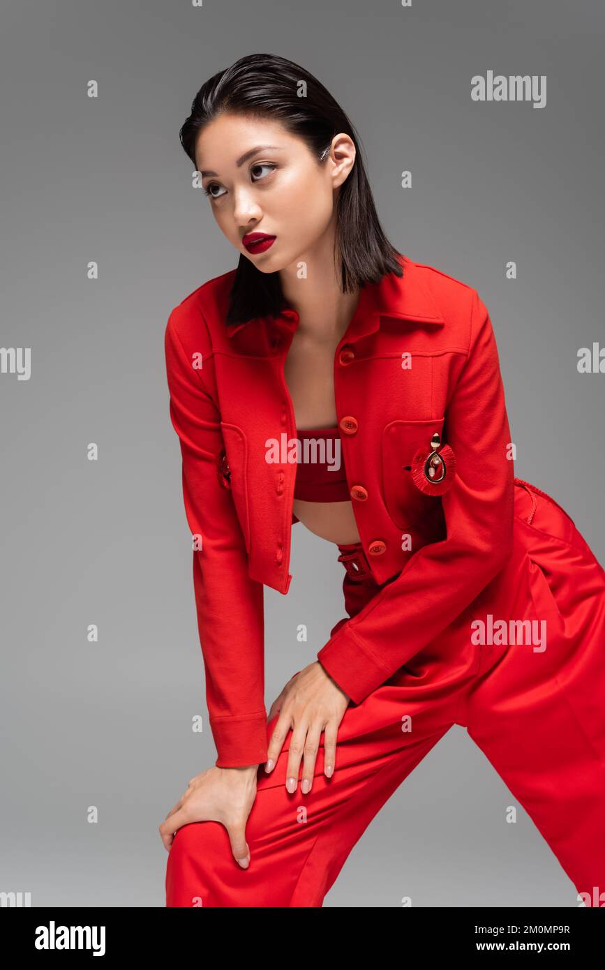 Red pants suit hi-res stock photography and images - Alamy