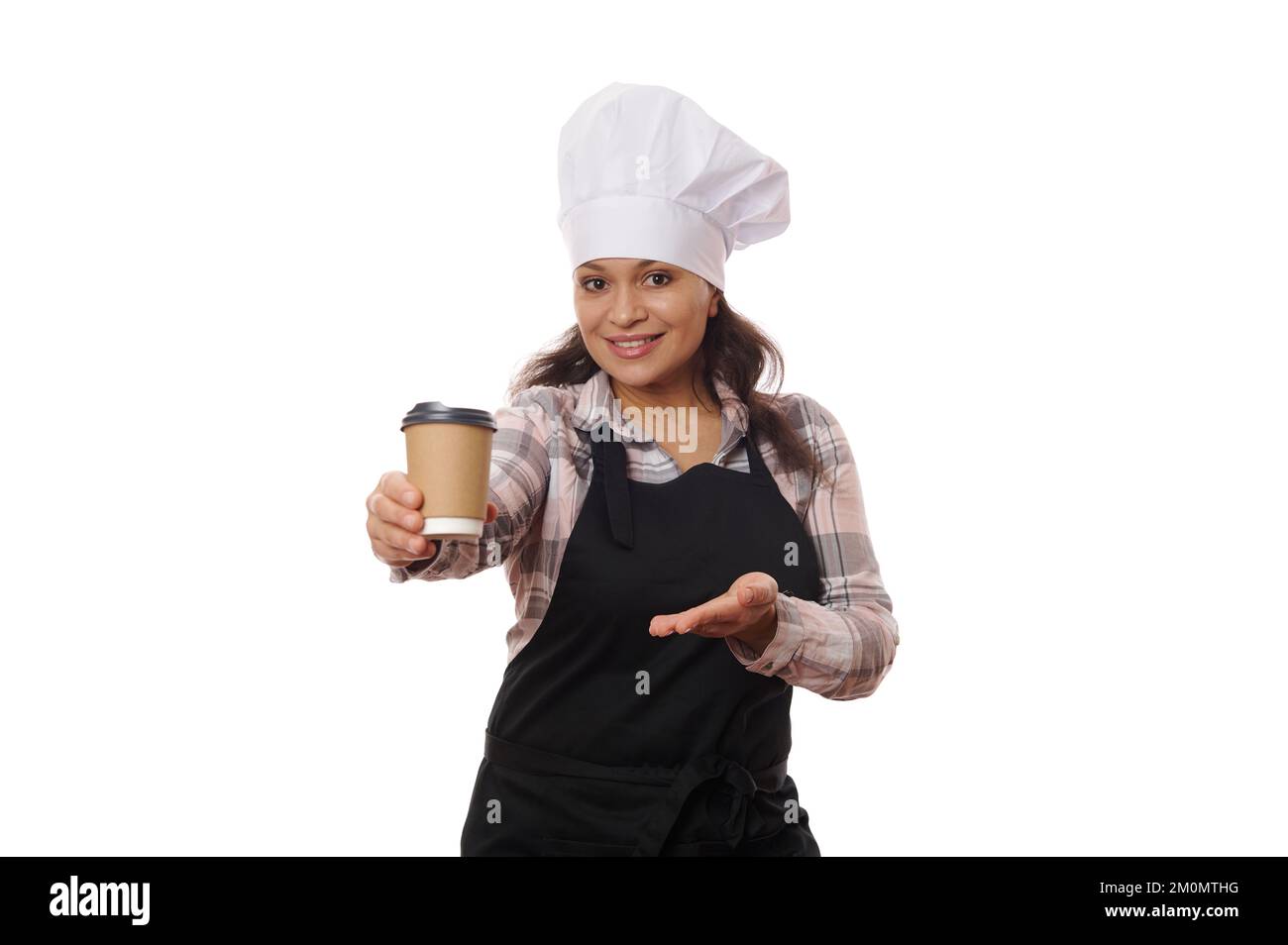 Pleasant female bartender waitress wearing chef hat and black apron