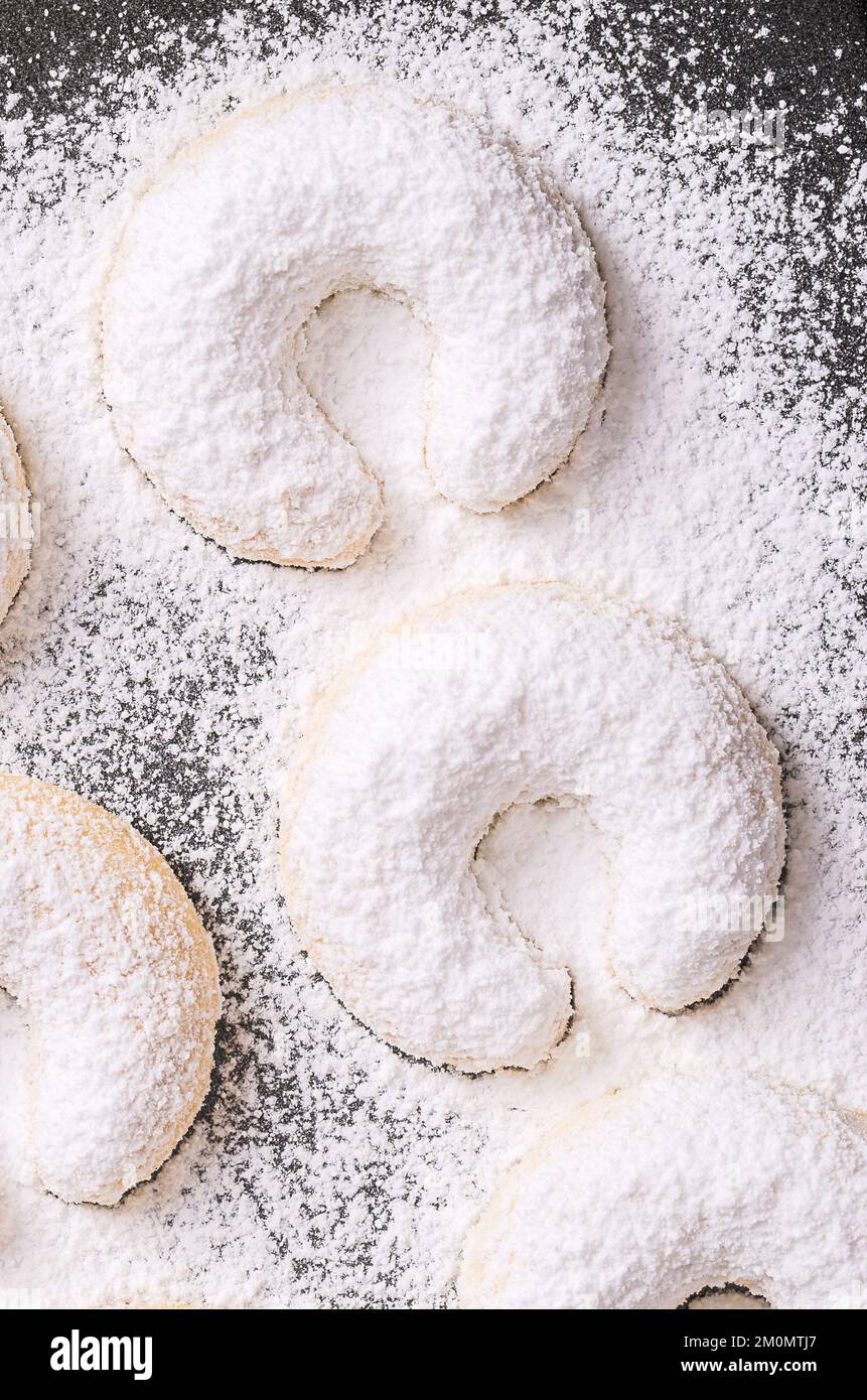 Vanilla crescents, Vanillekipferl, close-up on a baking tray. Crescent shaped Christmas biscuits, originally from Austria. Stock Photo