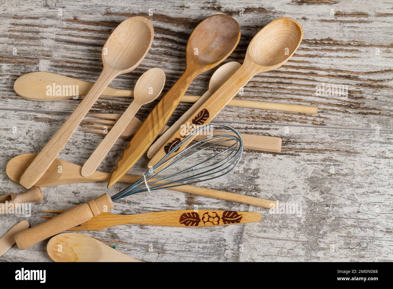 Top view rustic wooden kitchen utensils close up. Spoons and whisk ...