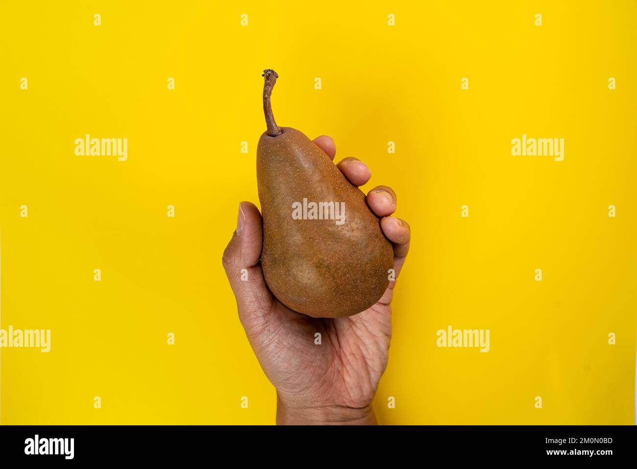 holding pear in the hand Stock Photo