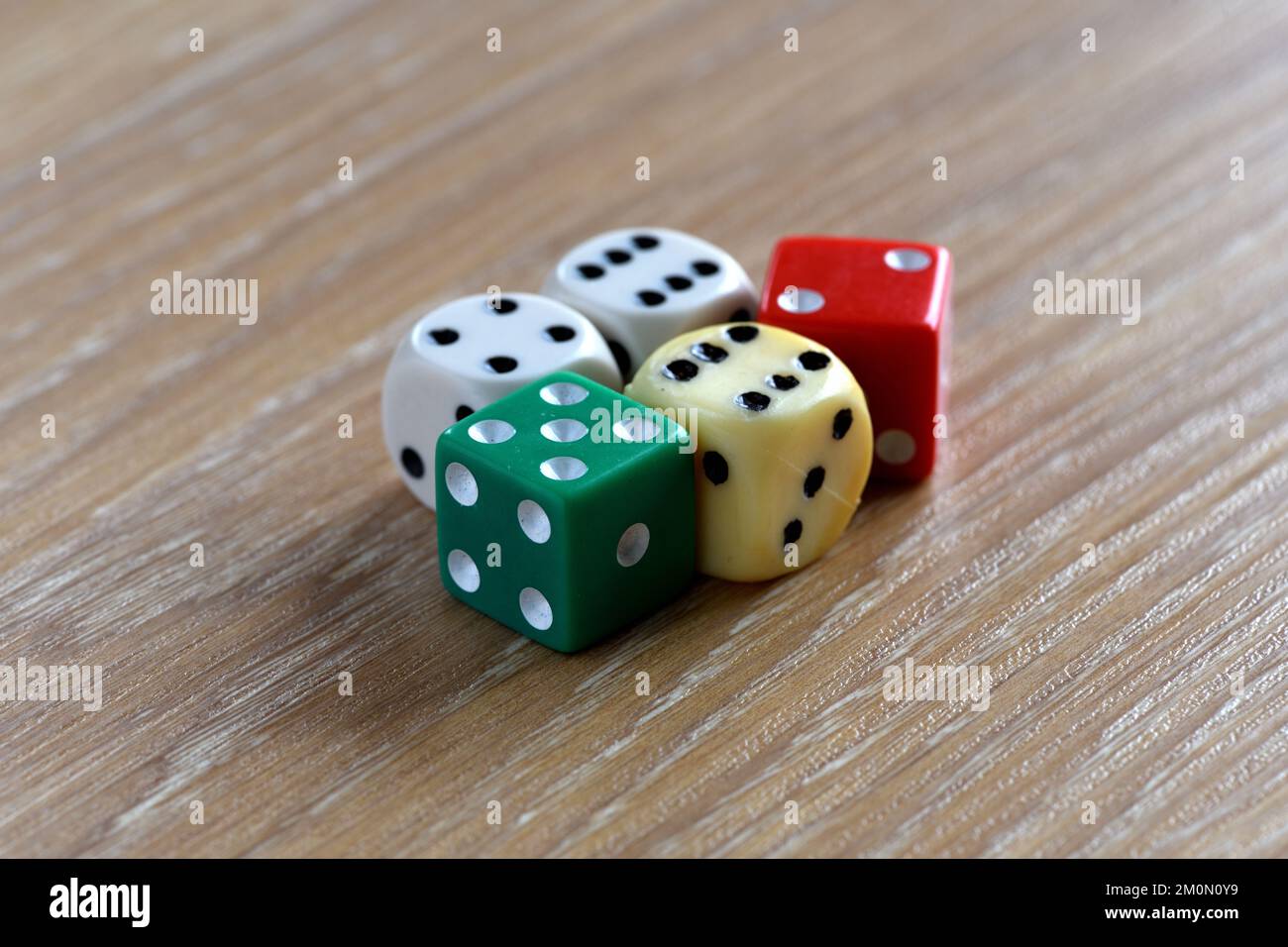 Old dice on a table Stock Photo Alamy