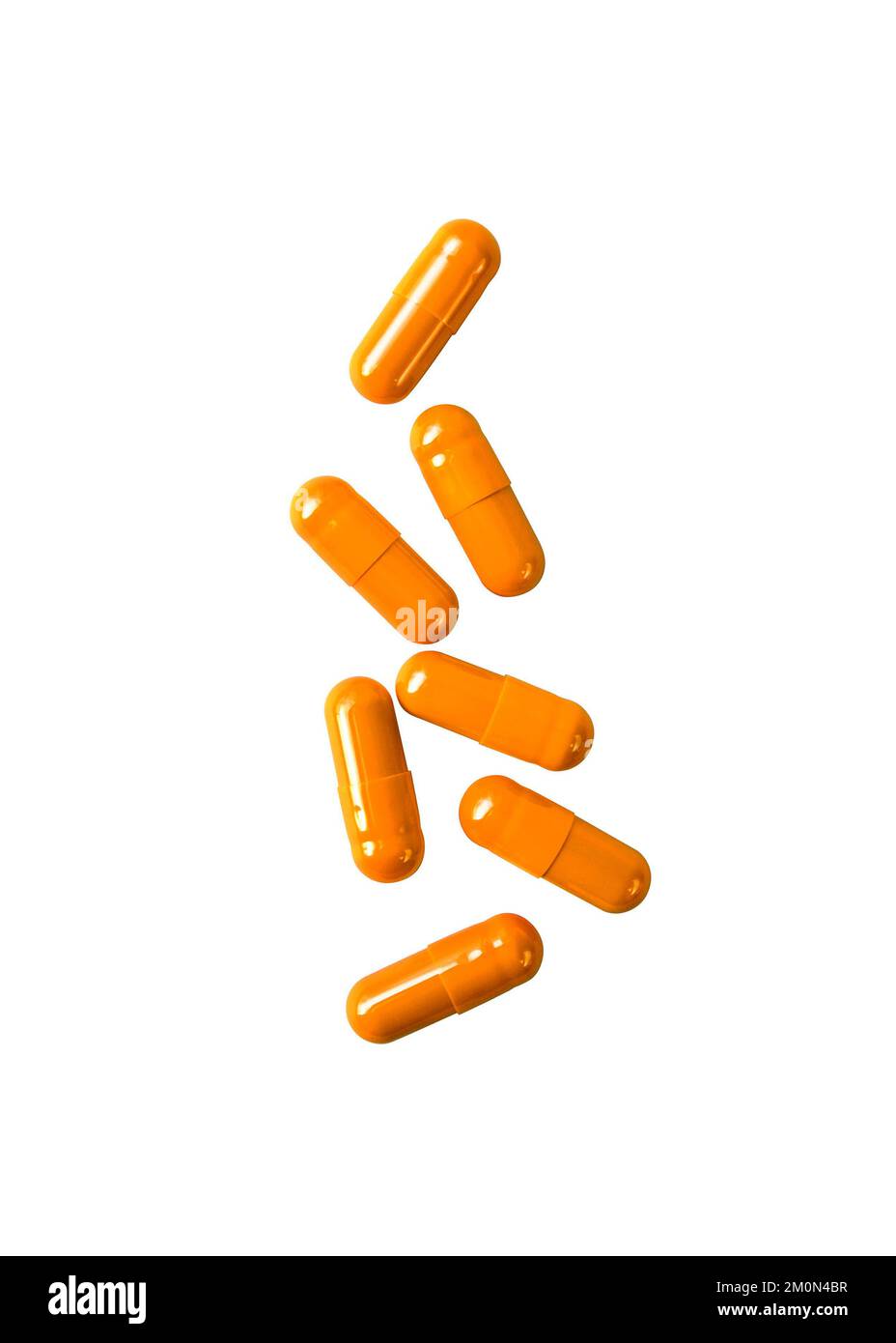 Orange pill capsules isolated on white background with clipping path